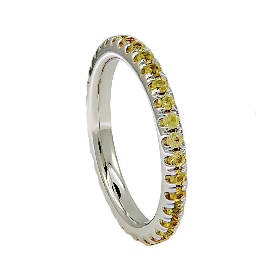 A dainty yellow Sapphire band that contains approximately 0.90 carats of yellow Sapphires. This chic ring can be worn single or stacked with the same or multiple colors for a fun accessory! 

The material of this ring is 18K gold.

