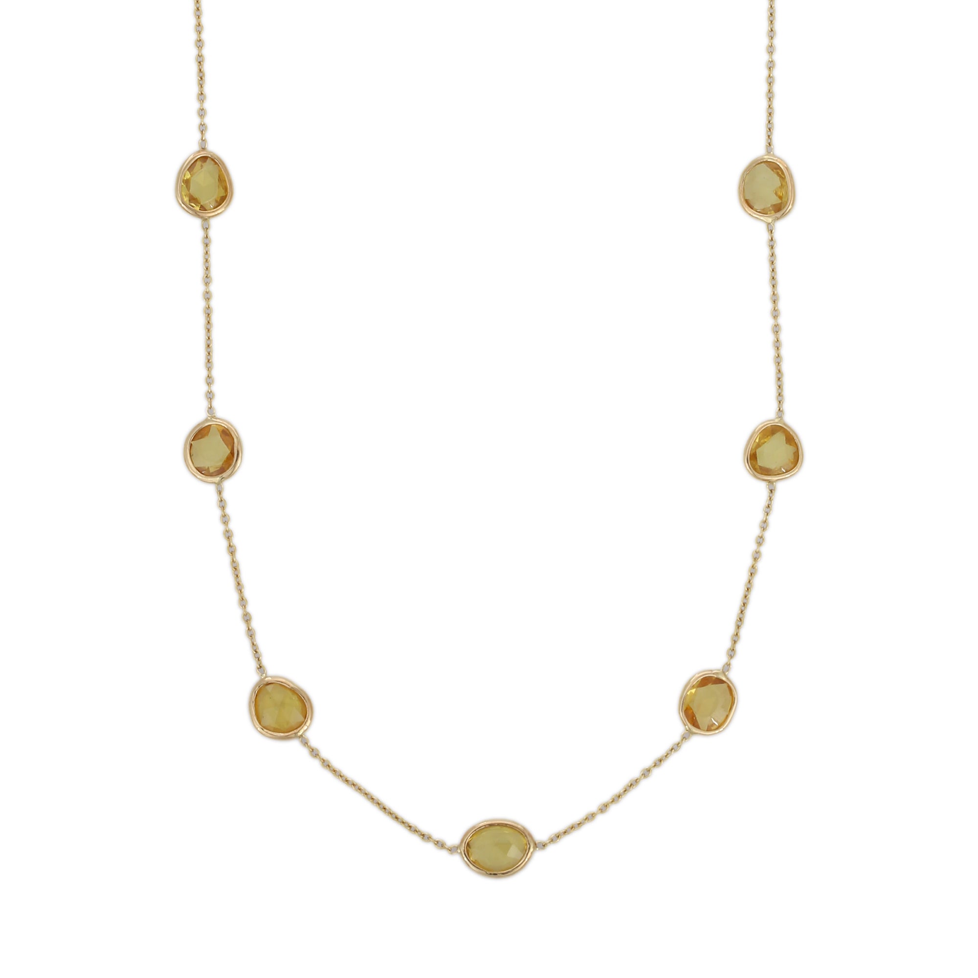 Yellow Sapphire Necklace in 18K Gold studded with mix cut sapphire pieces.
Accessorize your look with this elegant yellow sapphire chain necklace. This stunning piece of jewelry instantly elevates a casual look or dressy outfit. Comfortable and easy