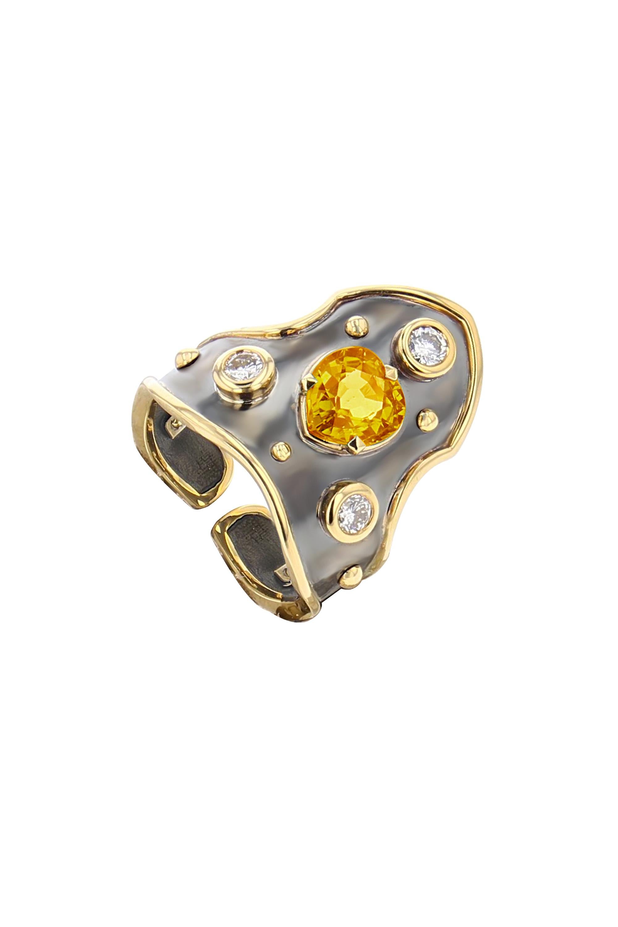 Yellow gold and distressed silver ring studded with a yellow sapphire heart surrounded by 3 diamonds.

Details:
Yellow Sapphire Madagascar Certified: 1.42 cts
Diamonds: 0.3 cts
18k Yellow Gold: 3.8 g
Distressed Silver: 2.9 g
Made in France