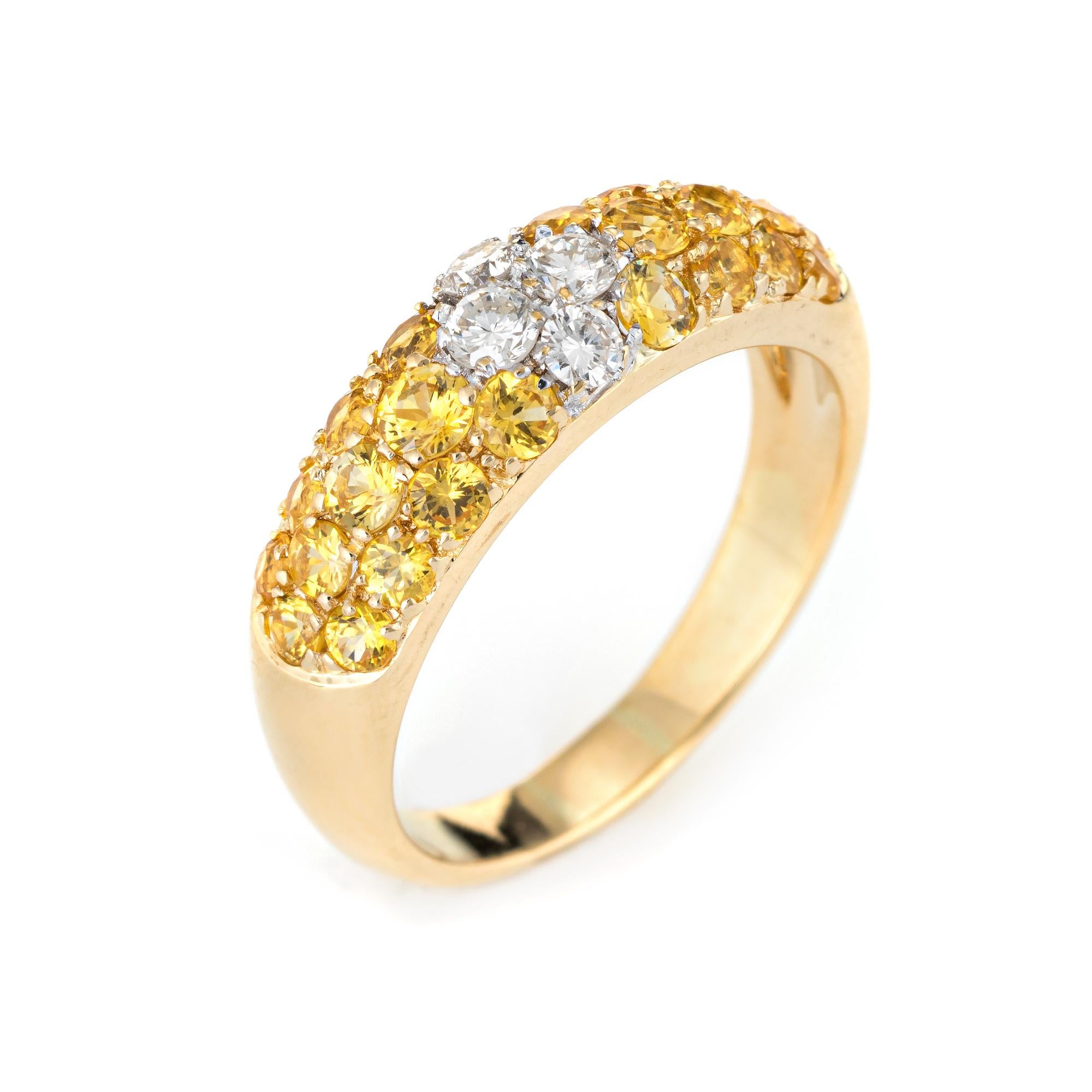 Stylish yellow sapphire & diamond band crafted in 18 karat yellow gold. 

Four round brilliant cut diamonds are estimated at 0.10 carats each and total an estimated 0.40 carats. The yellow sapphires total an estimated 2 carats. The sapphires are in