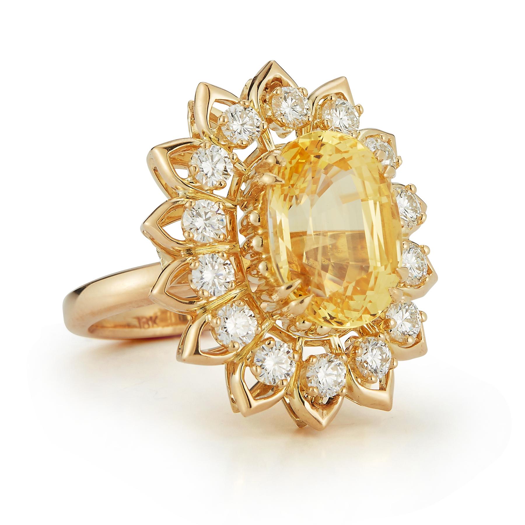 Oval Cut Yellow Sapphire & Diamond Flower Cocktail Ring 1 large oval cut yellow sapphire surrounded by 14 round cut diamonds set in 18k yellow gold

Ring Size: 6 

Re sizable free of charge 