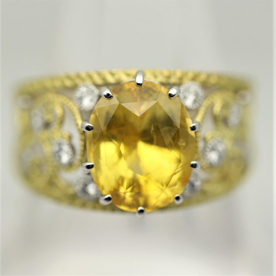 Hand-crafted in both 18k yellow gold and fine platinum, this ring is stylish and elegant. It features a 6.19 carat oval-shape yellow sapphire that is bright and vibrant. It is accented by 0.23 carats of round brilliant-cut diamonds as well as