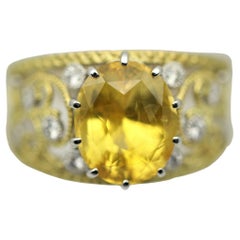 Zweifarbiger Ring aus Gold und Platin mit gelbem Saphir und Diamant
