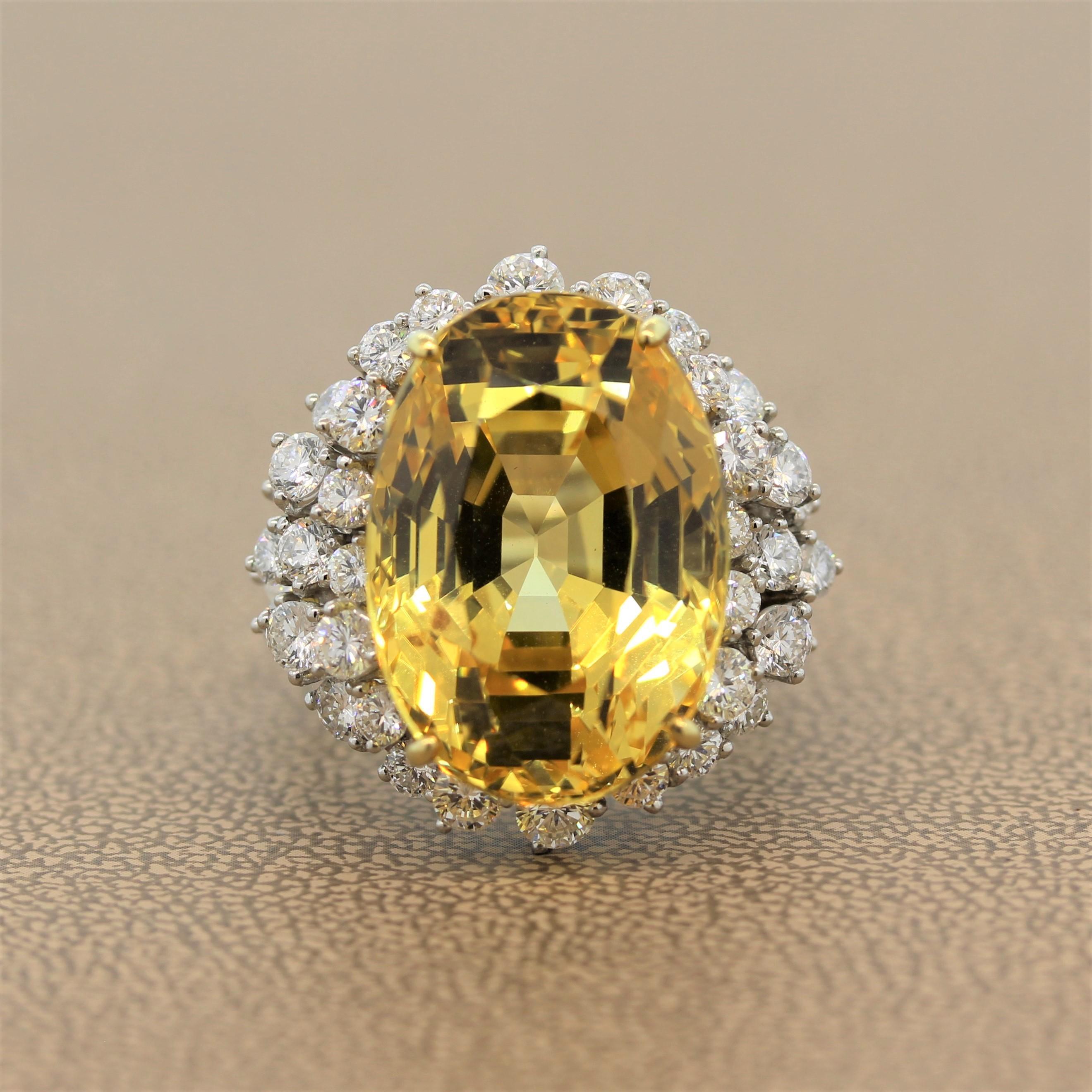A great cocktail ring featuring an extremely rare 35.00 carat AGL certified unheated yellow sapphire. The vibrant pure yellow colored sapphire has a beautiful cut and shape enhancing its brilliance and light return to the eye. It is enclosed by a