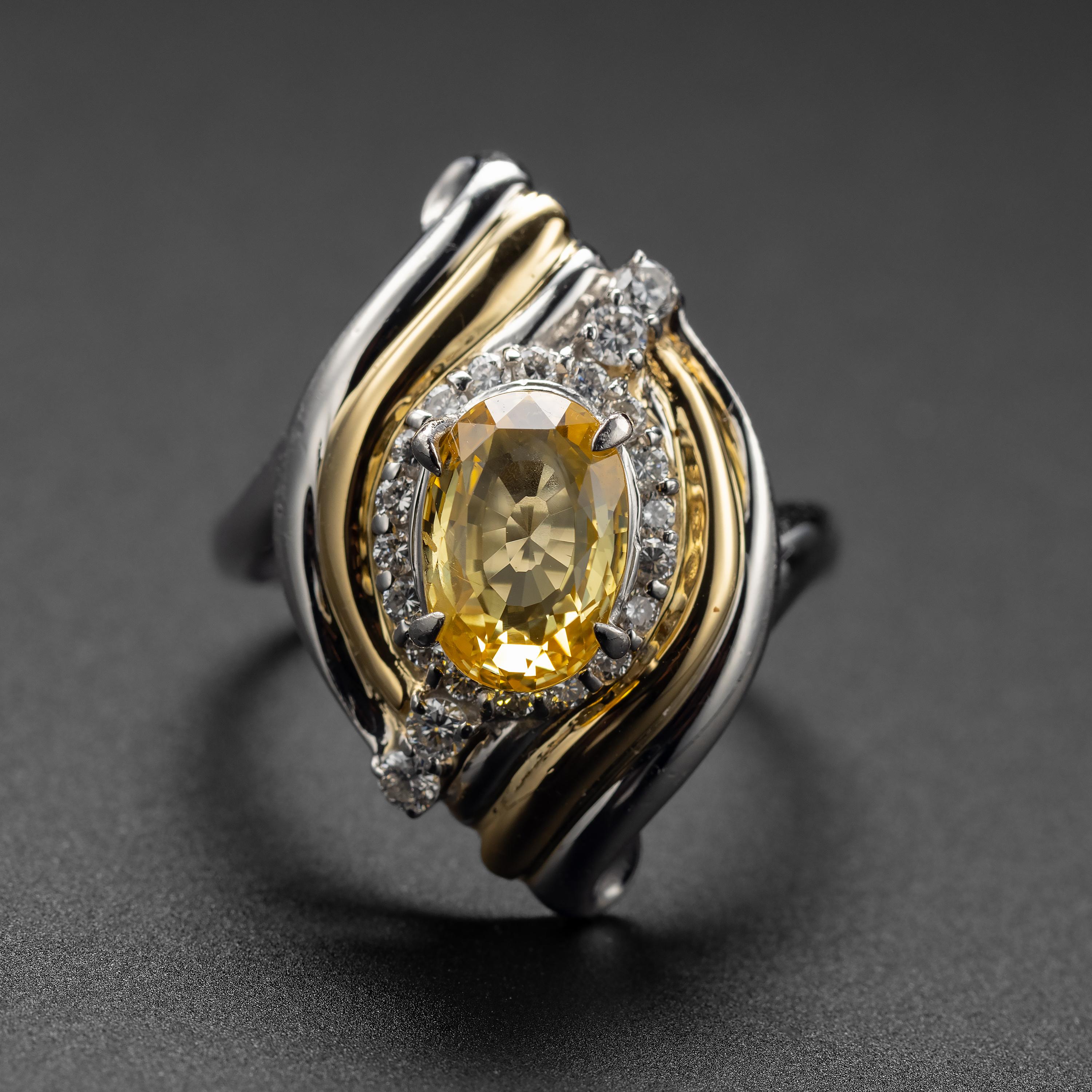 It is like your own private sun: a bright yellow, 2.87-carat natural yellow sapphire, GIA certified to be unheated. Flashing with sultry fire, this rare gemstone measures 9.74mm x 6.70mm and resides within a handmade setting created in gleaming
