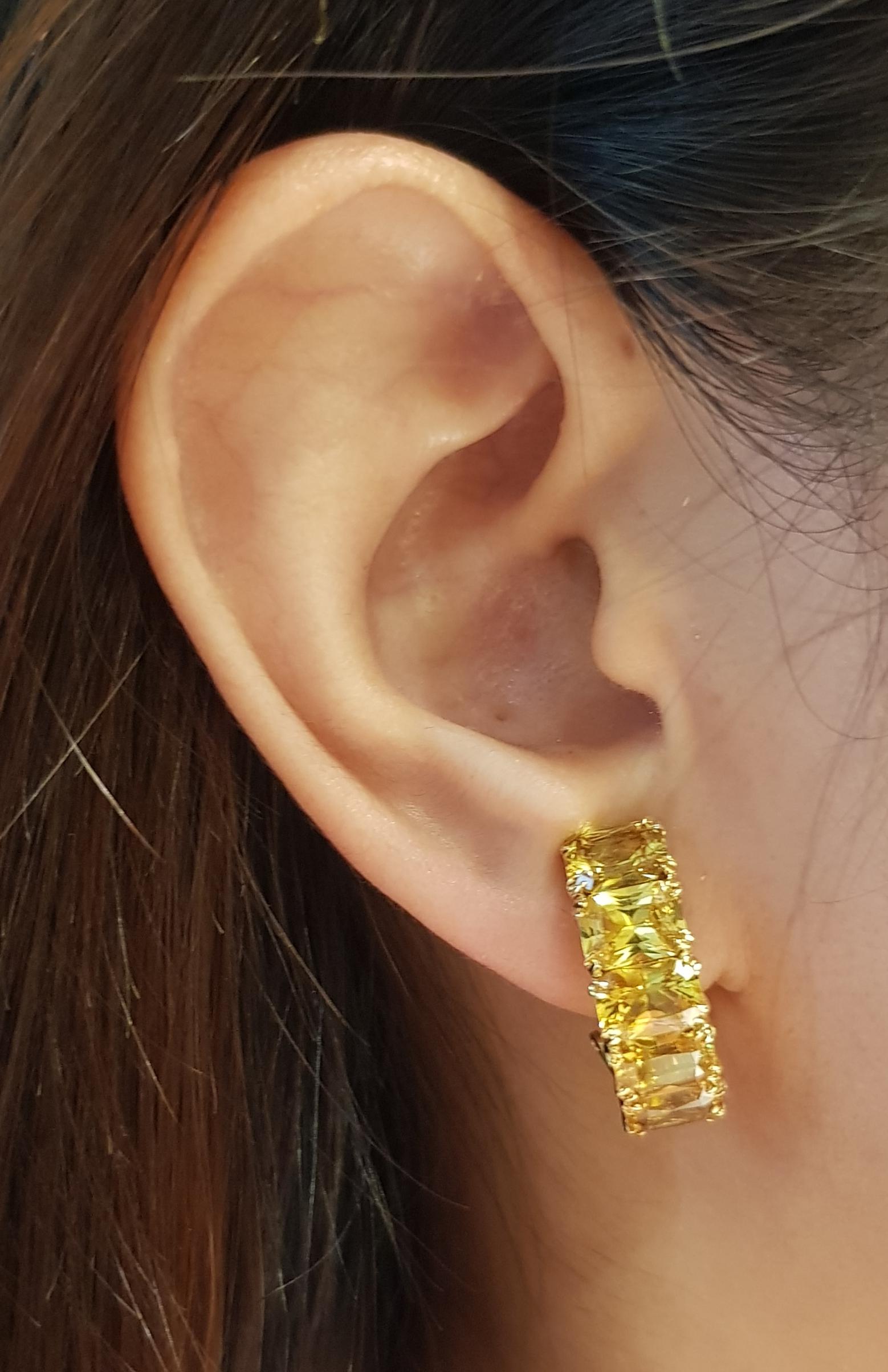 Yellow Sapphire 10.99 carats Earrings set in 18 Karat Gold Settings

Width:   0.7 cm 
Length:  2.2 cm
Total Weight: 10.73 grams

