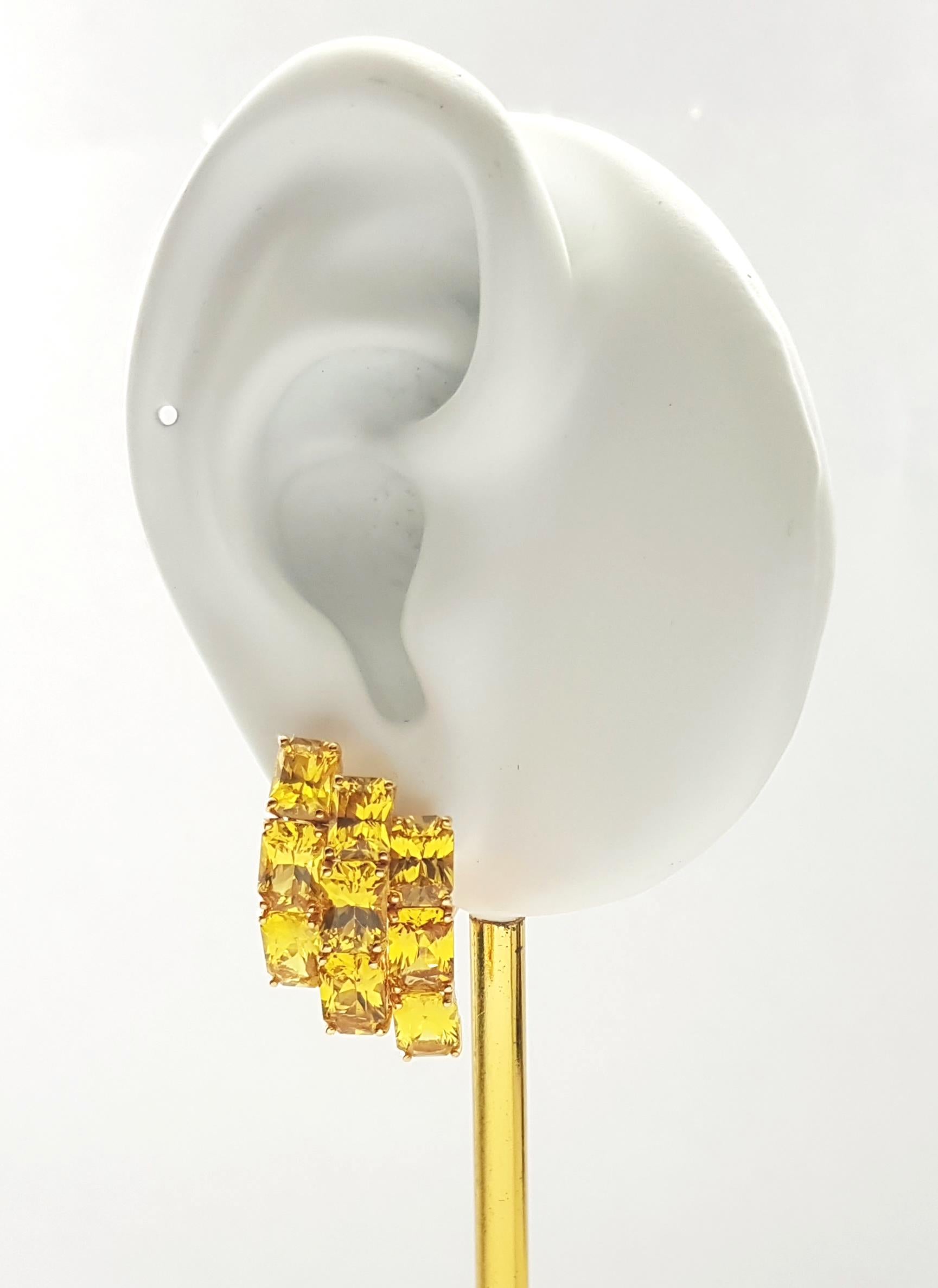 Yellow Sapphire 20.02 carats Earrings set in 18K Gold Settings

Width: 1.5 cm 
Length: 2.7 cm
Total Weight: 14.14 grams

