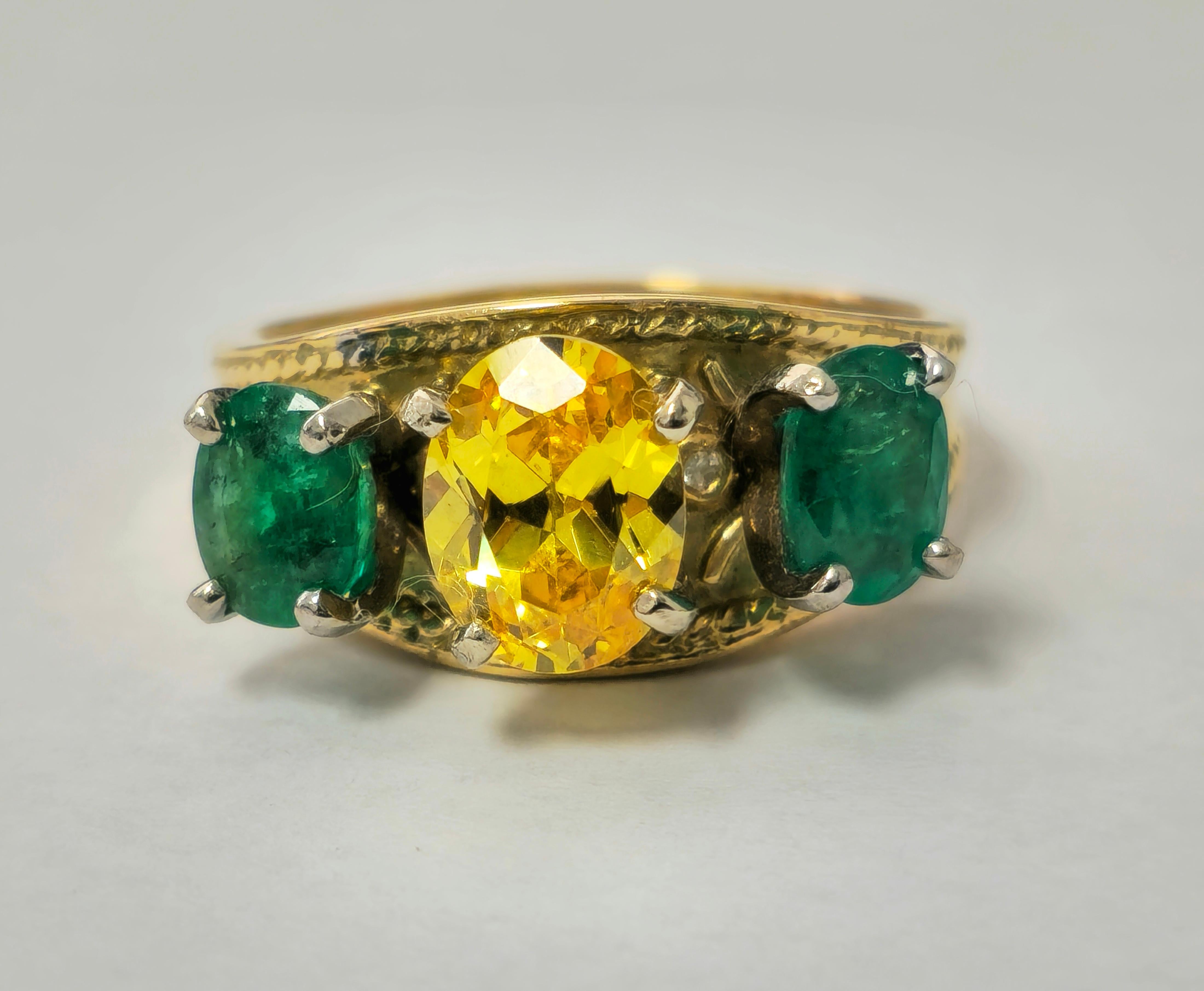 Crafted in 18k yellow gold, this enchanting ring features a 3.76 carat yellow sapphire and 1.20 carat total emerald, both 100% natural earth mined gemstones. With an oval shape and a total weight of 8.20 grams, it's a captivating cocktail ring