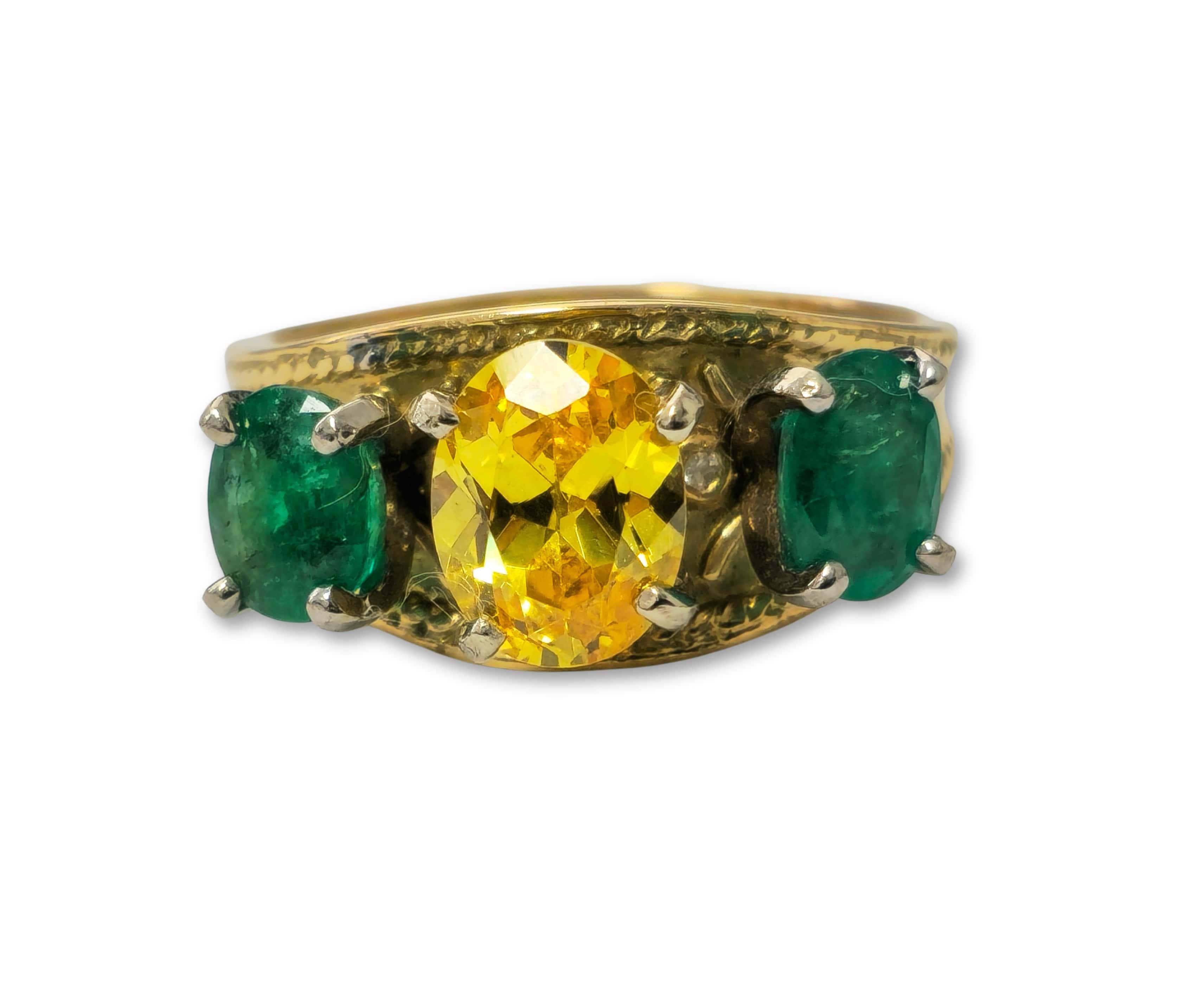 Crafted in 18k yellow gold, this enchanting ring features a 3.76 carat yellow sapphire and 1.20 carat total emerald, both 100% natural earth mined gemstones. With an oval shape and a total weight of 8.20 grams, it's a captivating cocktail ring