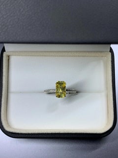 Yellow sapphire emerald diamonds engagement ring in platinum.