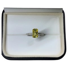 Yellow sapphire emerald diamonds engagement ring in platinum.