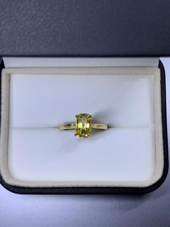 Yellow sapphire emerald engagement ring in 18k yellow gold.