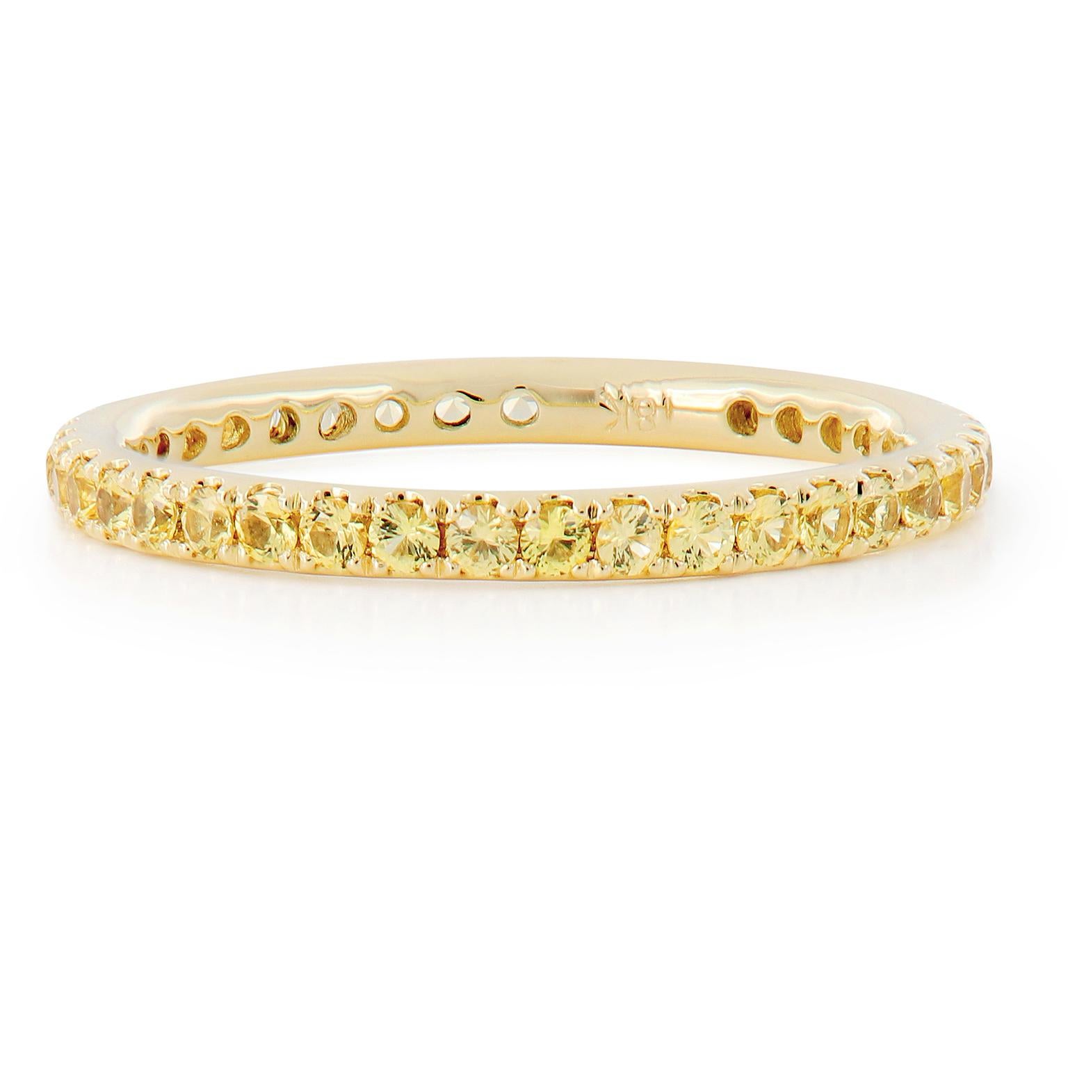 Sunny is this 18 karat gold and yellow sapphire eternity ring with 39 sapphires = 0.90 Cttw in a size 6! Sapphire is the birthstone for September and also given as a gem for the 5th, 23rd and 45th wedding anniversaries. This ring looks fantastic