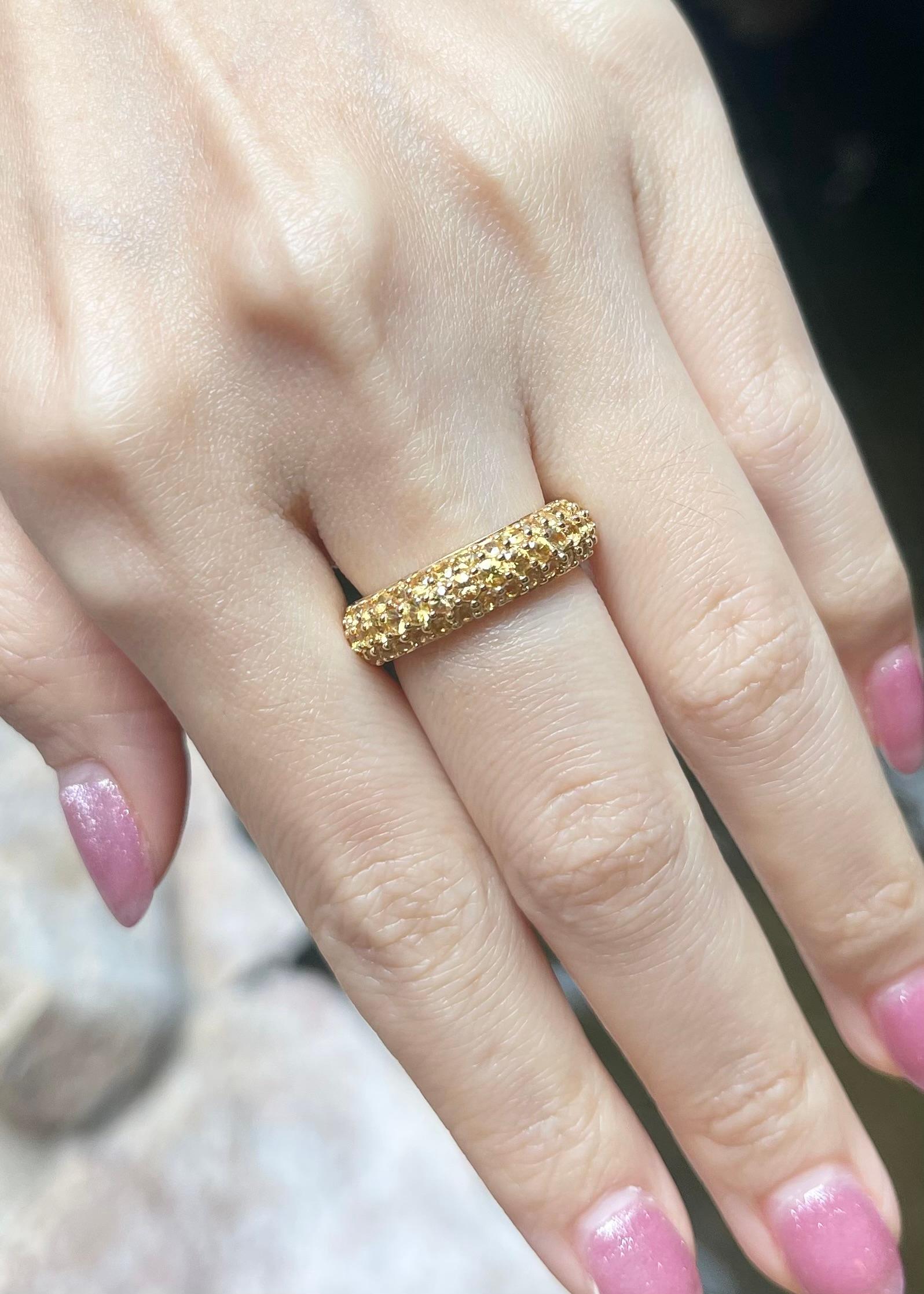 Brilliant Cut Yellow Sapphire Eternity Ring set in 18K Gold Settings For Sale