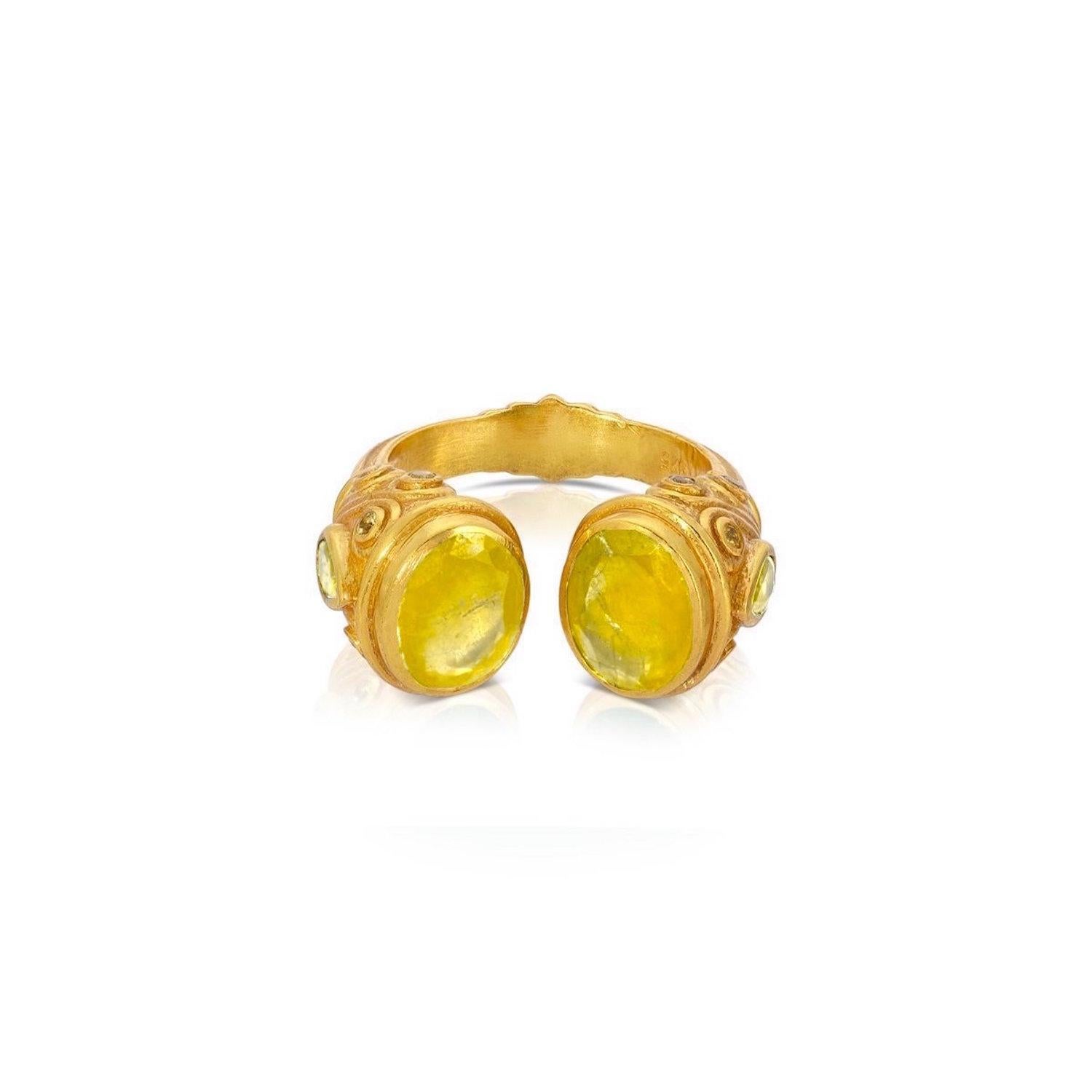 A contemporary interpretation of the opulent jewelry style of the Moguls. A Yellow Sapphire ring featuring an open ended band tipped with Yellow Sapphires and pear shaped gemstones on the side of the ring. This gorgeous ring features 3.85 Carats of
