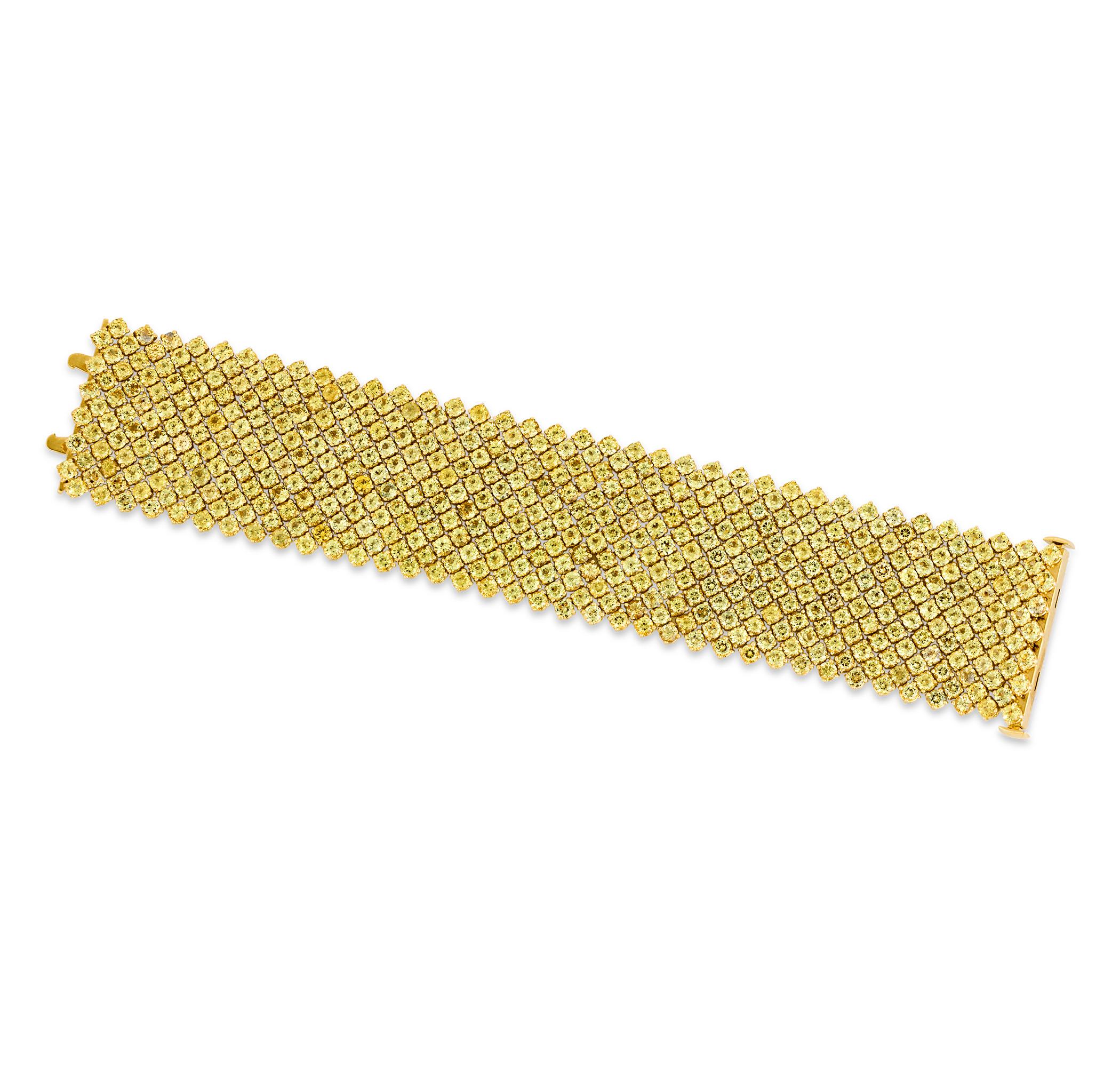 This breathtaking mesh bracelet showcases a remarkable 66.24 carats of vivid natural yellow sapphires. Pairing any two yellow sapphires is an impressive feat, given their wide color spectrum, but perfectly matching over 480 of the finest examples is
