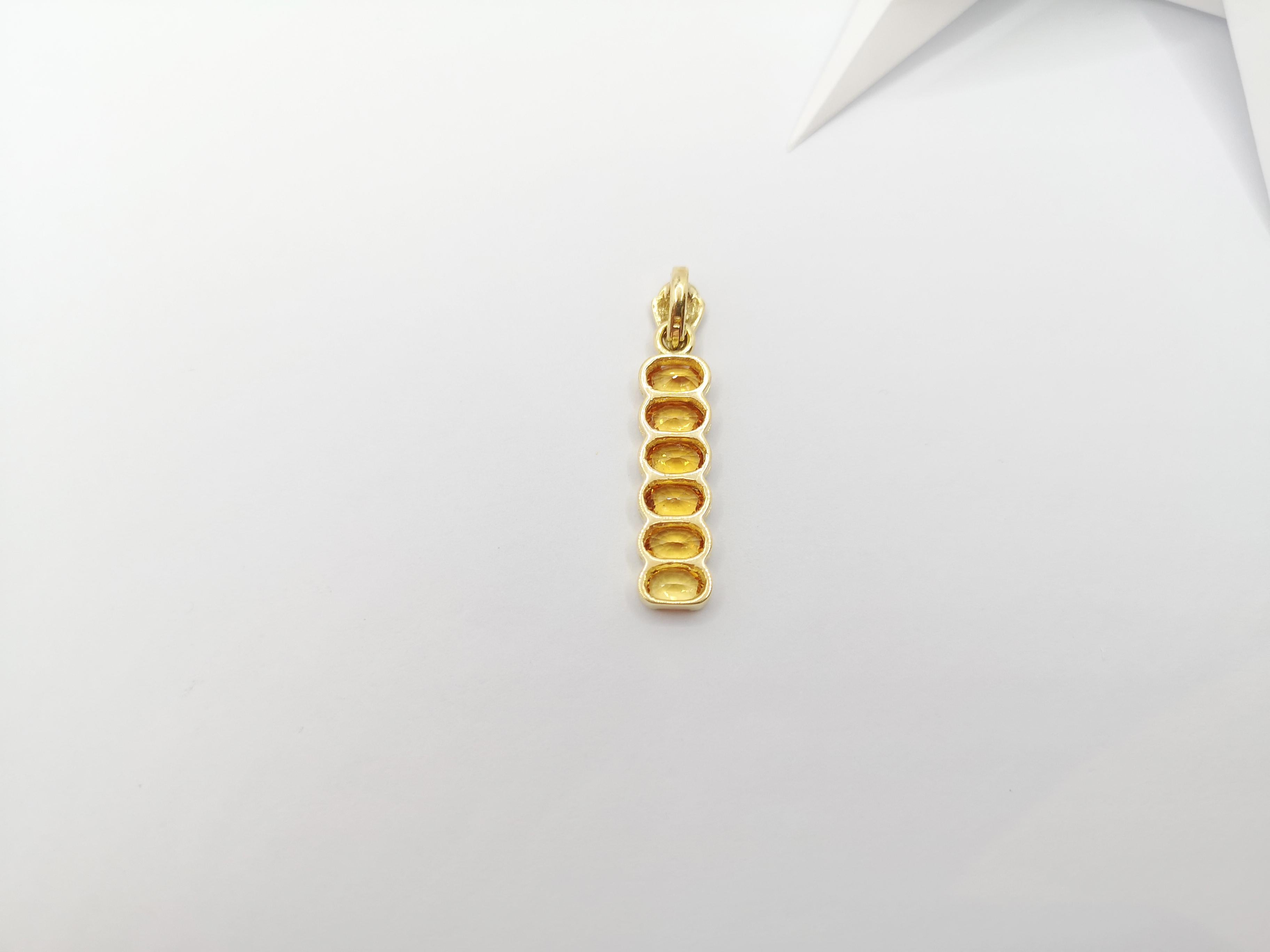 Oval Cut Yellow Sapphire Pendant Set in 18 Karat Gold Settings For Sale