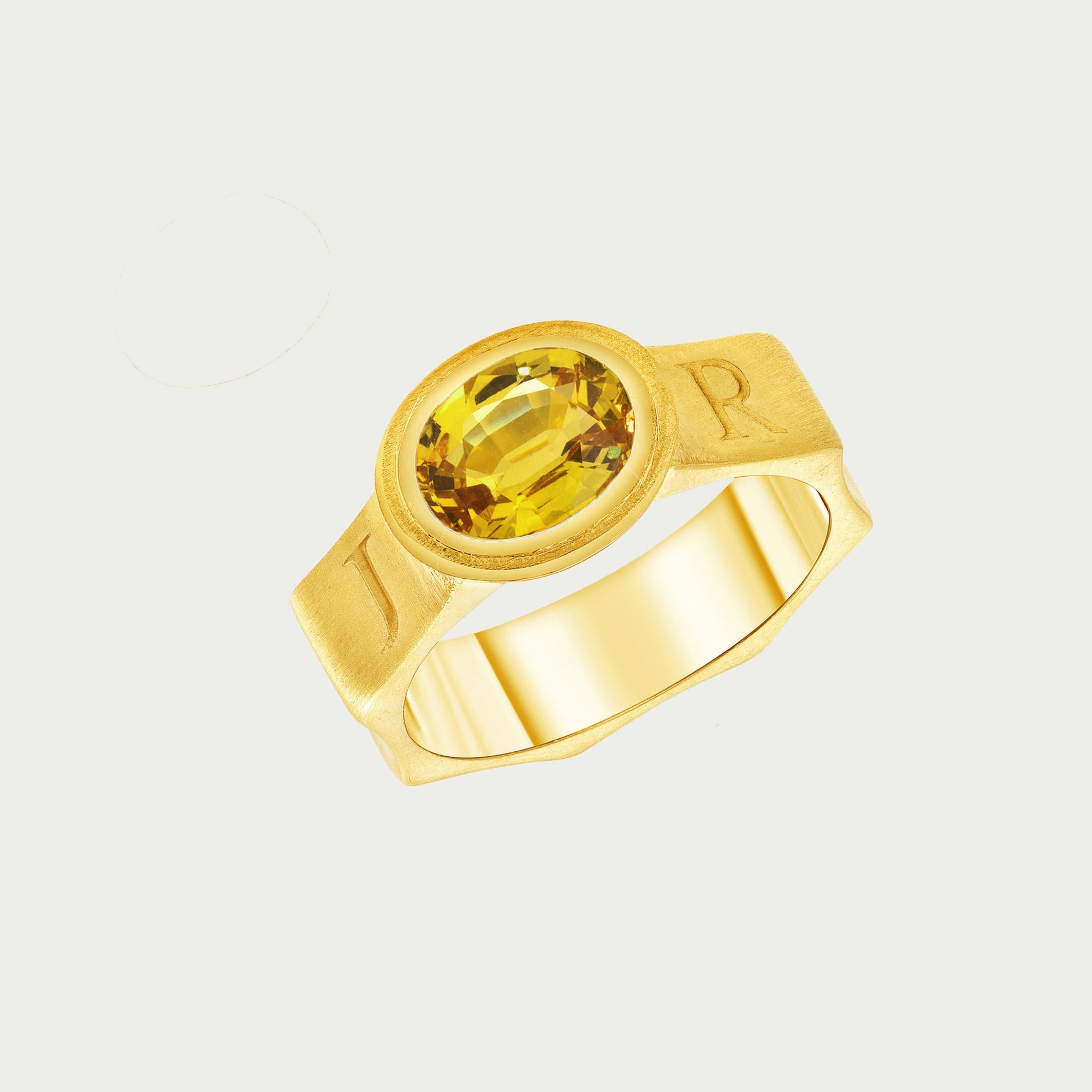 Yellow Sapphire Ring In 22 Karat Yellow Gold 

This unique ring features a 2.3 carat oval shape yellow sapphire crafted into 22 karat yellow gold. The medieval style band is designed in an octagonal shape, and around the band is engraved JUPITER,
