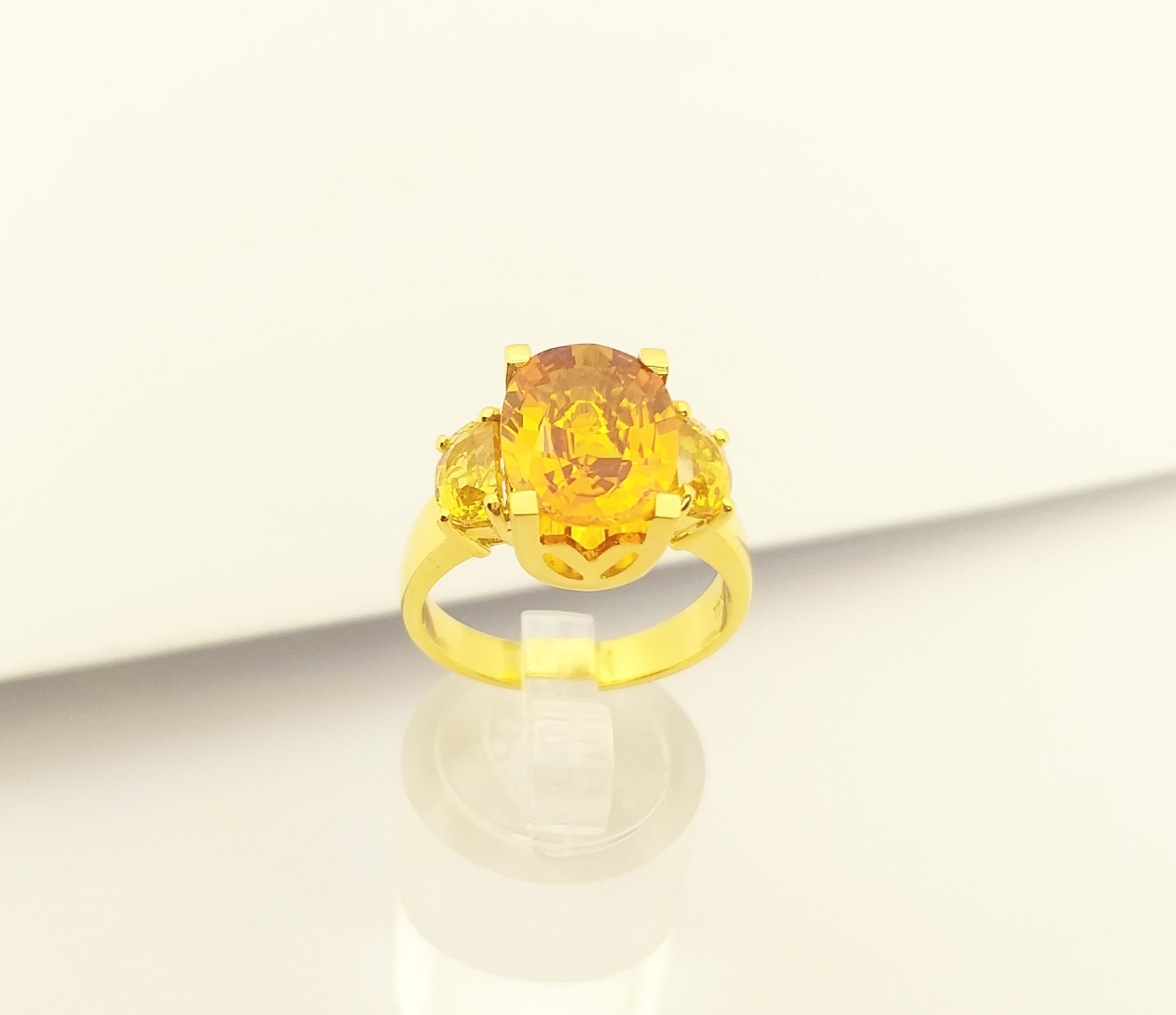 Oval Cut Yellow Sapphire Ring set in 18K Gold Settings For Sale