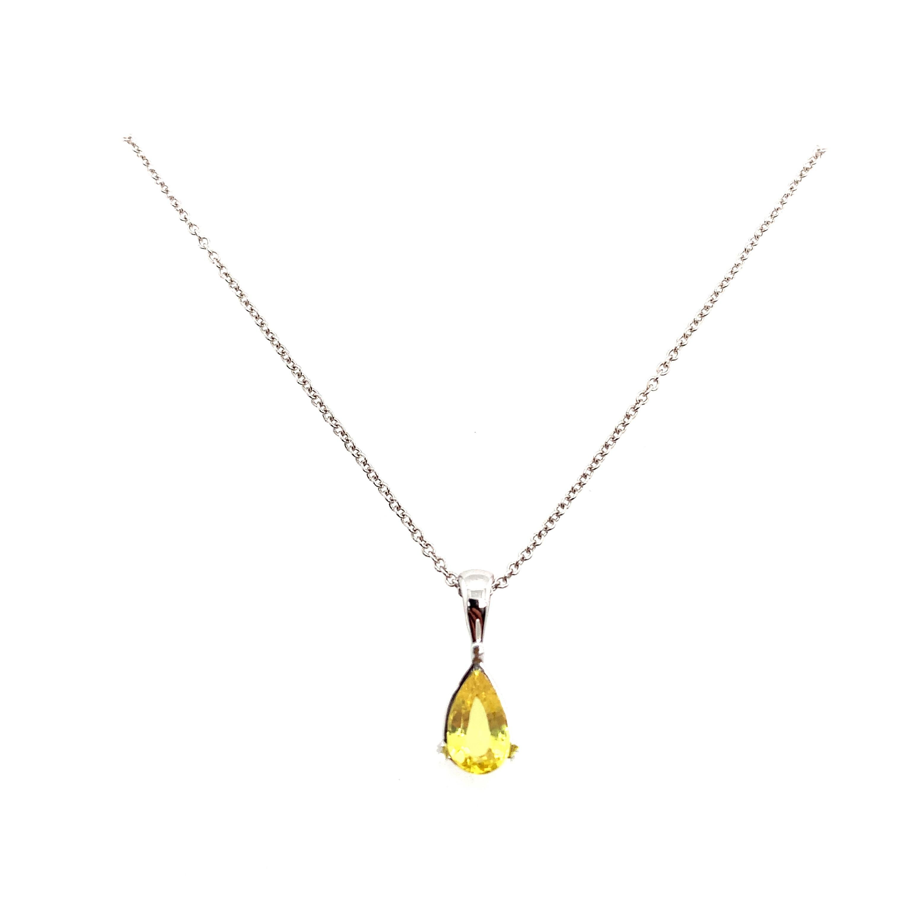 Yellow sapphire solitaire pendant necklace 18k white gold
Yellow sapphire natural pear shaped total weight 0.75ct  natural untreated sapphire mounted in 18k white gold on 18 inches chain length. 
Hallmarked.
Solitaire style pendant necklace with