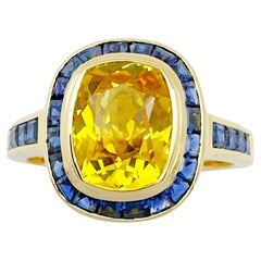 Ring mit gelbem Saphir und blauem Saphir in 18 Karat Goldfassungen gefasst
