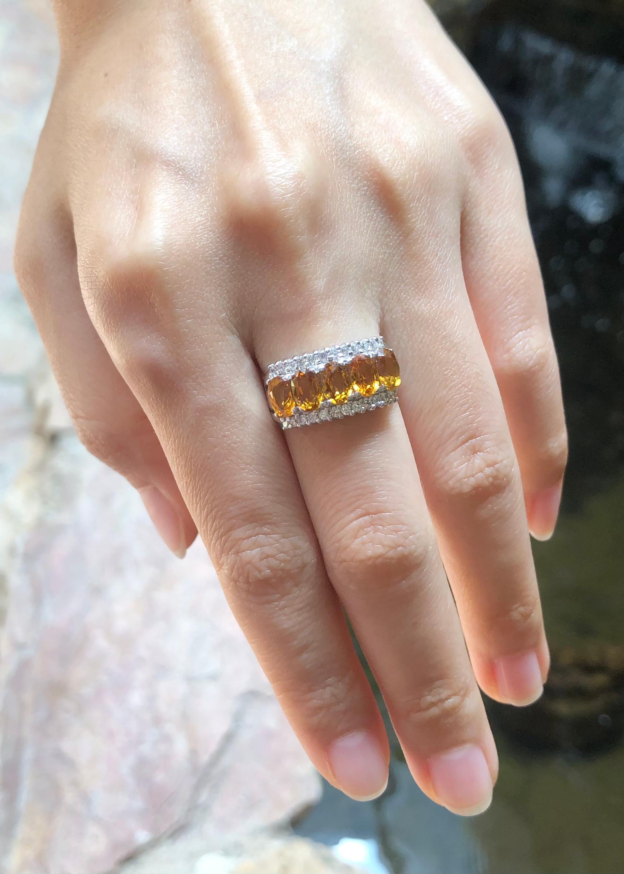 Contemporary Yellow Sapphire with Cubic Zirconia Ring set in Silver Settings For Sale