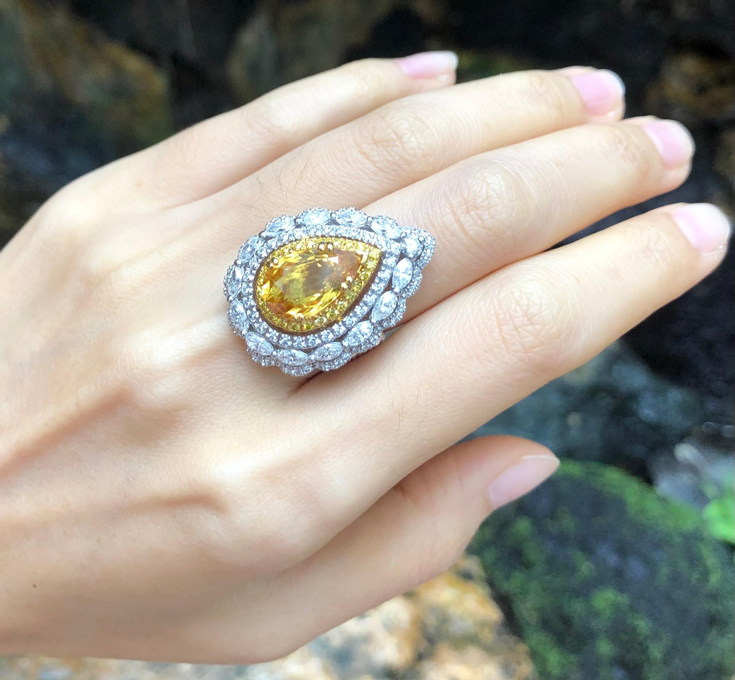 Yellow Sapphire 5.03 carats with Diamond 2.36 carats and Yellow Diamond 0.28 carats Ring set in 18 Karat White Gold Settings

Width:  2.1 cm 
Length:  2.9 cm
Ring Size: 49
Total Weight: 19.27 grams


