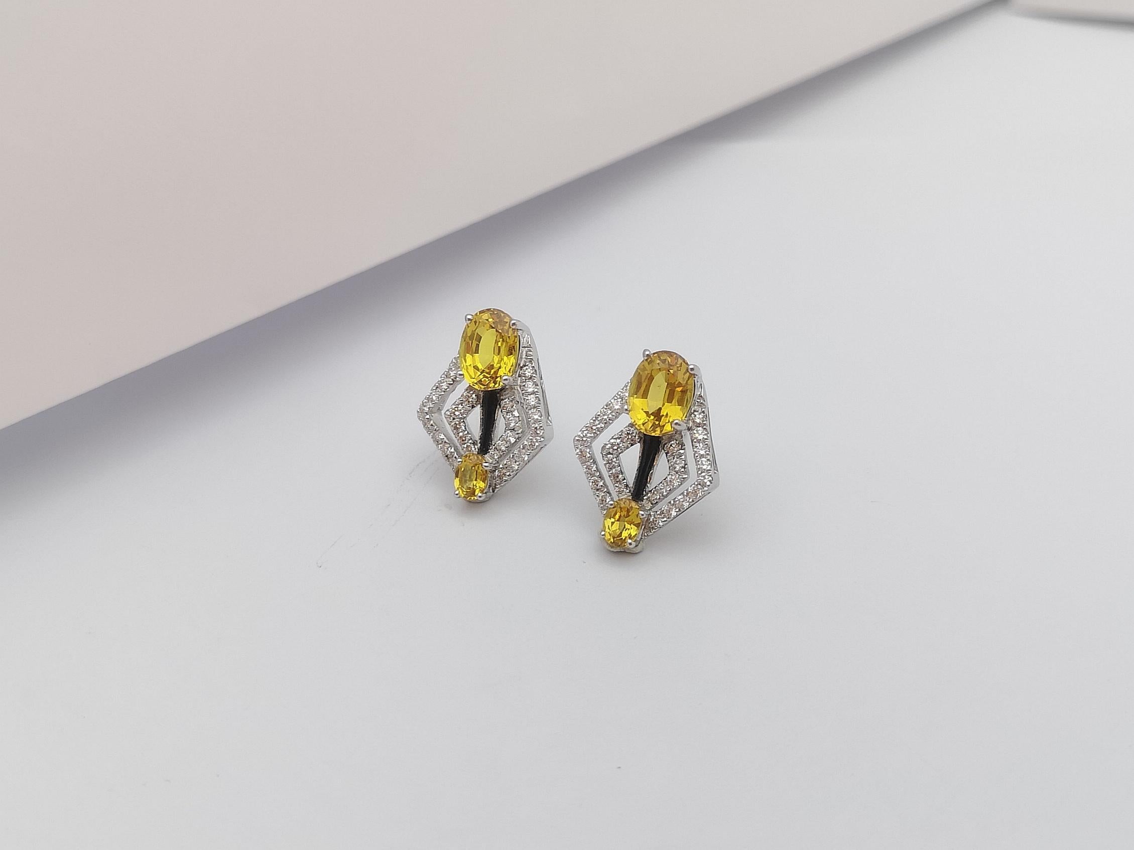 Women's Yellow Sapphire with Diamond Earrings Set in 18 Karat White Gold Settings For Sale
