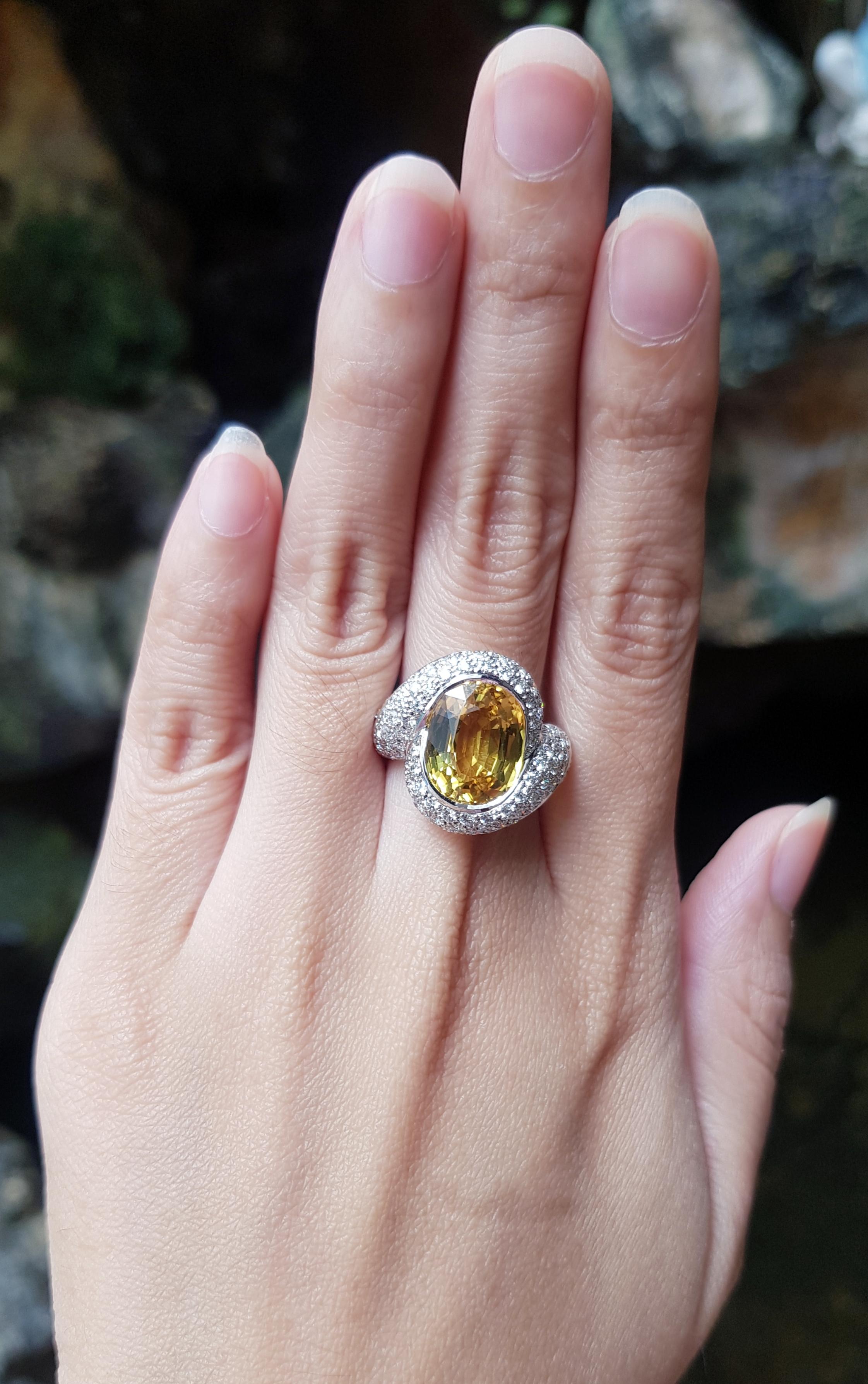 Yellow Sapphire 7.34 carats with Diamond 1.57 carats and Yellow Sapphire 0.86 carat Ring set in 18 Karat White Gold Settings

Width:  1.8 cm 
Length: 1.9 cm
Ring Size: 55
Total Weight: 10.12 grams

