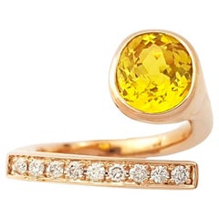 Bague en or rose 18 carats ornée d
un saphir jaune et d
un diamant