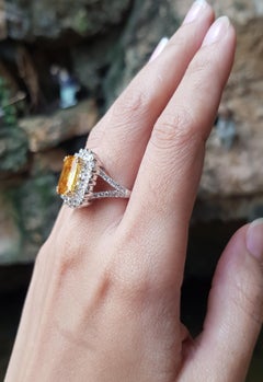 Yellow Sapphire with Yellow Diamond and Diamond Ring Set in 18 Karat White Gold