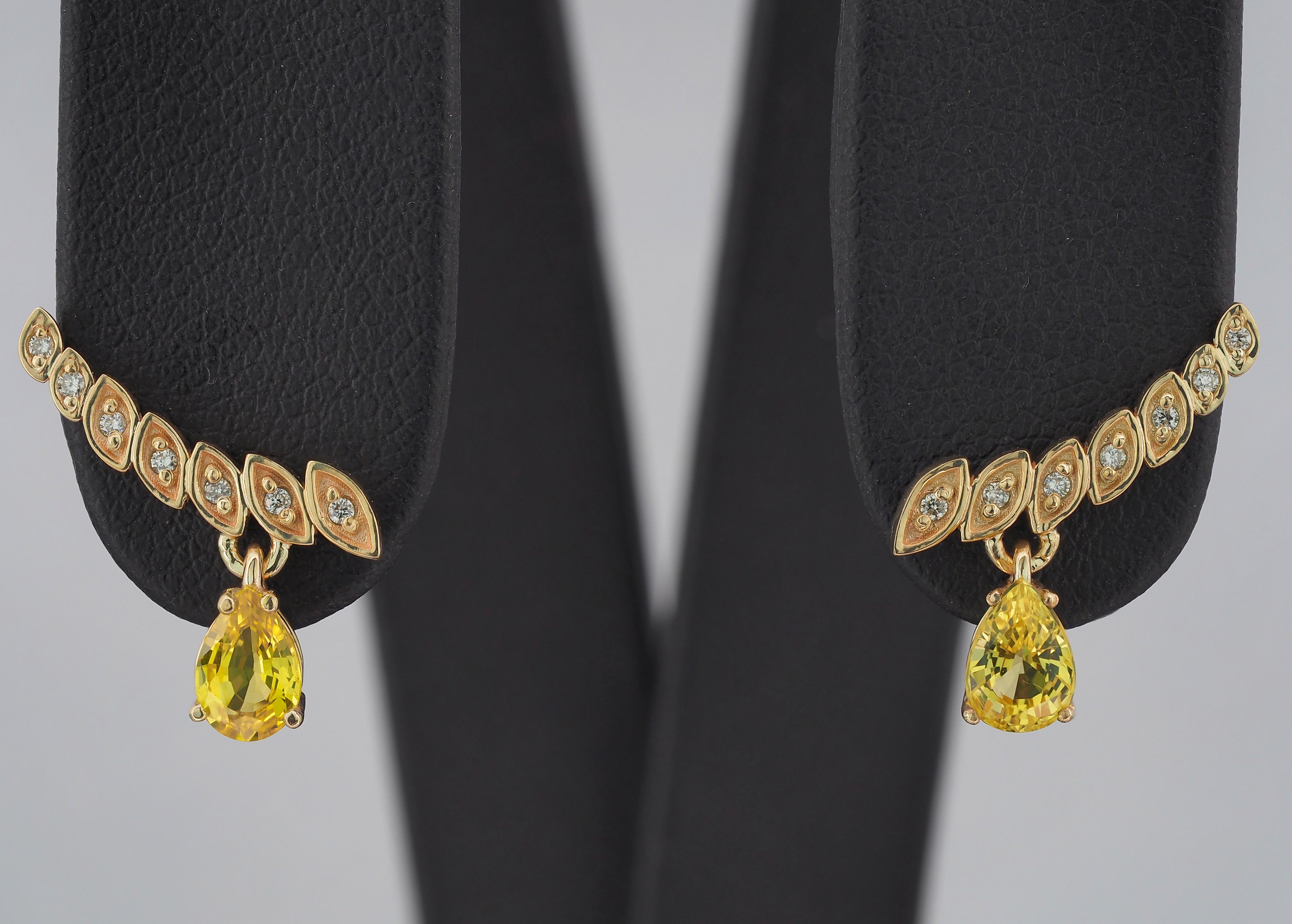 Yellow sapphires and diamonds earrings studs. 
14k solid gold studs. Pear cut sapphire earrings. September birthstone studs.

Total weight: 2.3 g.
Metal: 14k gold.
Size 15.5x10 mm.

Central stones: Natural Sapphires - 2 pieces
Cut: Pear
Weight: aprx