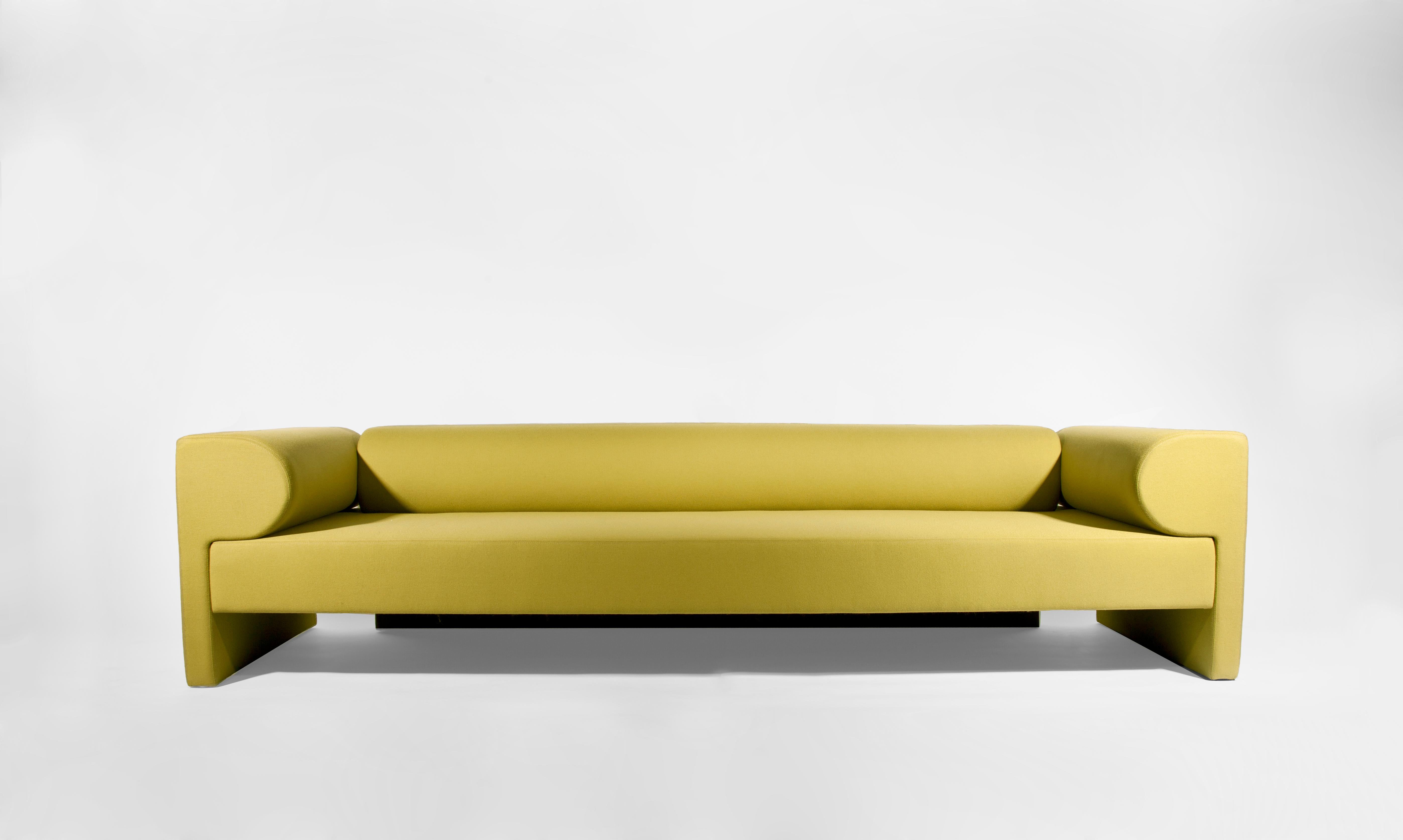 Yellow say sofa by Gentner Design.
Dimensions: D 271 x W 86 x H 63.5 cm.
Materials: fabric.
COM available.

Strong formal lines and geometric shapes seem like puzzle pieces that come together defining the Say Sofa. COM options and other
