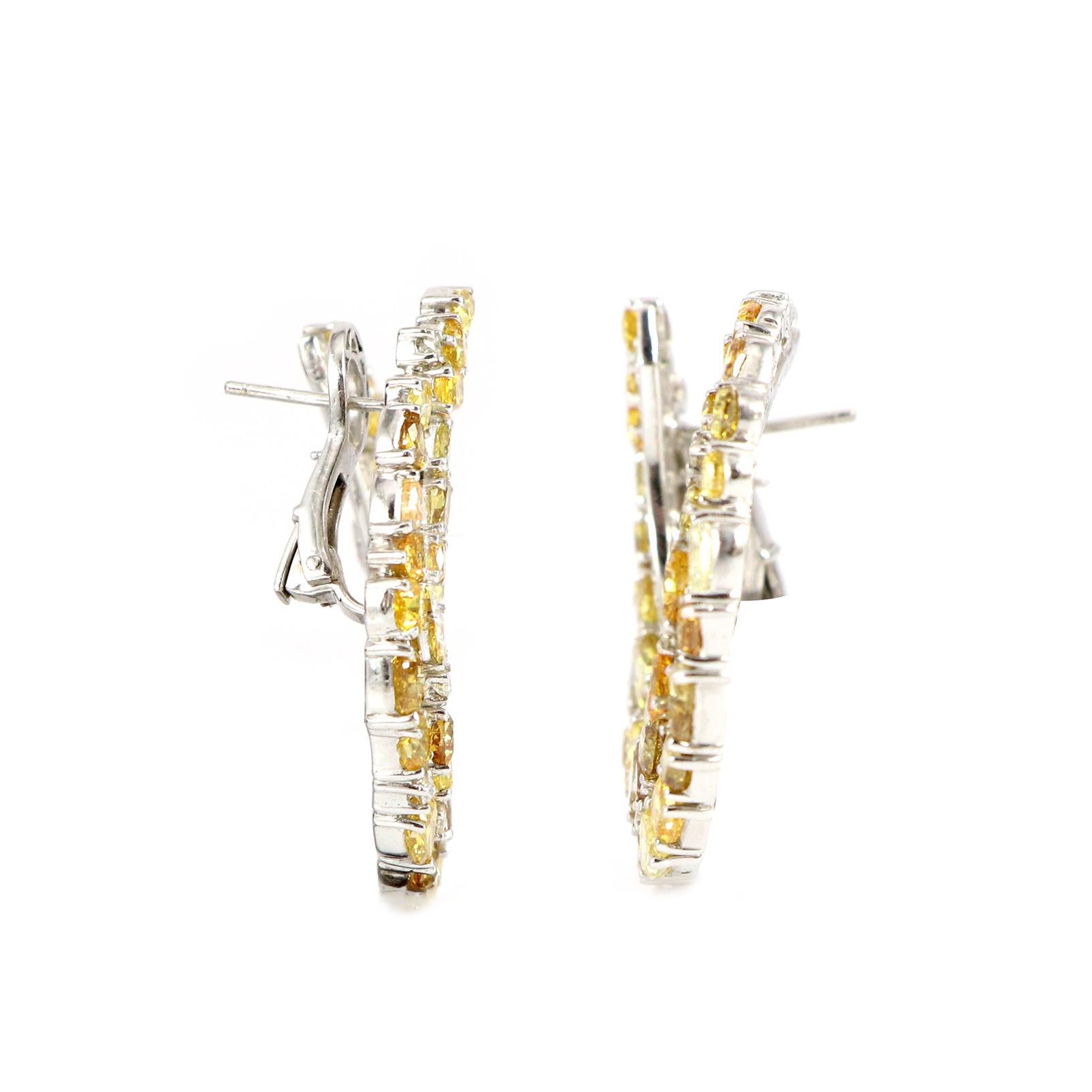 Introducing our stunning earrings designed to infuse elegance and radiance into your style. Whether you adore the warm glow, the vibrant sparkle, or the delicate charm of yellow diamonds, we offer the ideal pair to enhance any ensemble. Each Diamond
