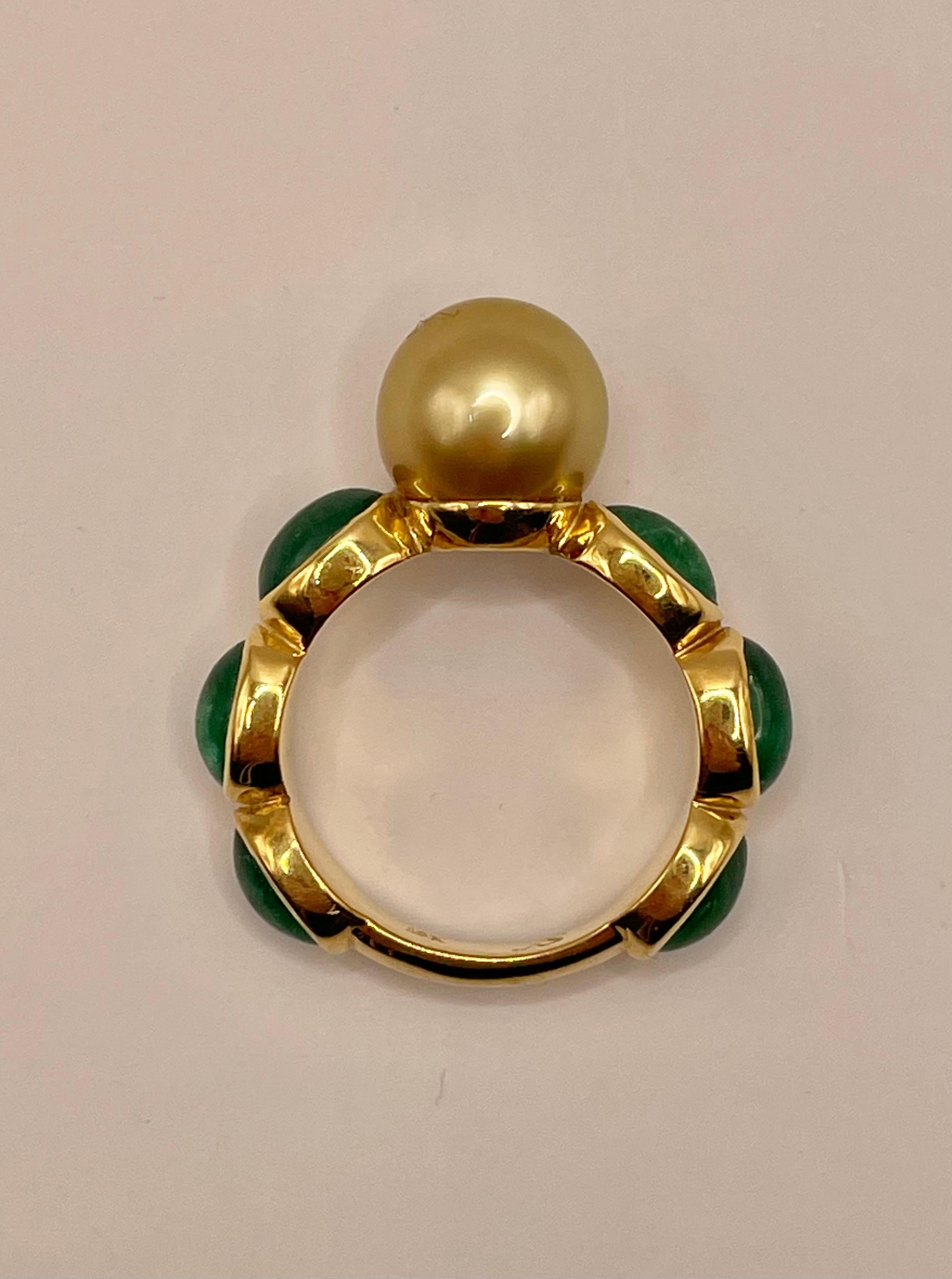 Yellow 10mm south sea pearl and 6 cabochon emeralds ring set in 18k yellow gold ,size 6.5.
One of a kind !