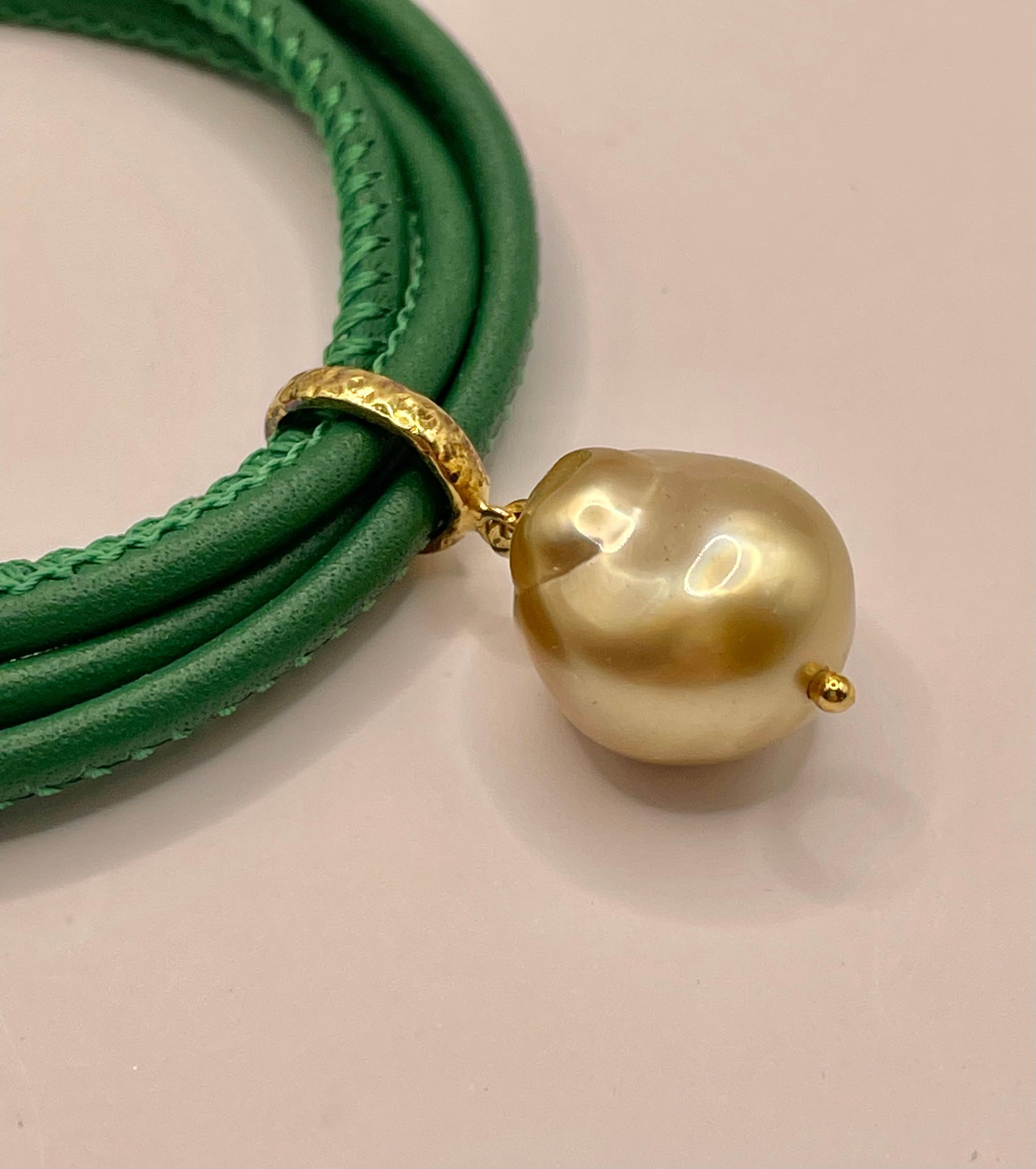 Yellow south sea baroque  pearl and green Italian leather bracelet . 18K  yellow gold.  Wraps twice  around the wrist .Cool fashion style , this  bracelet will set you a part !