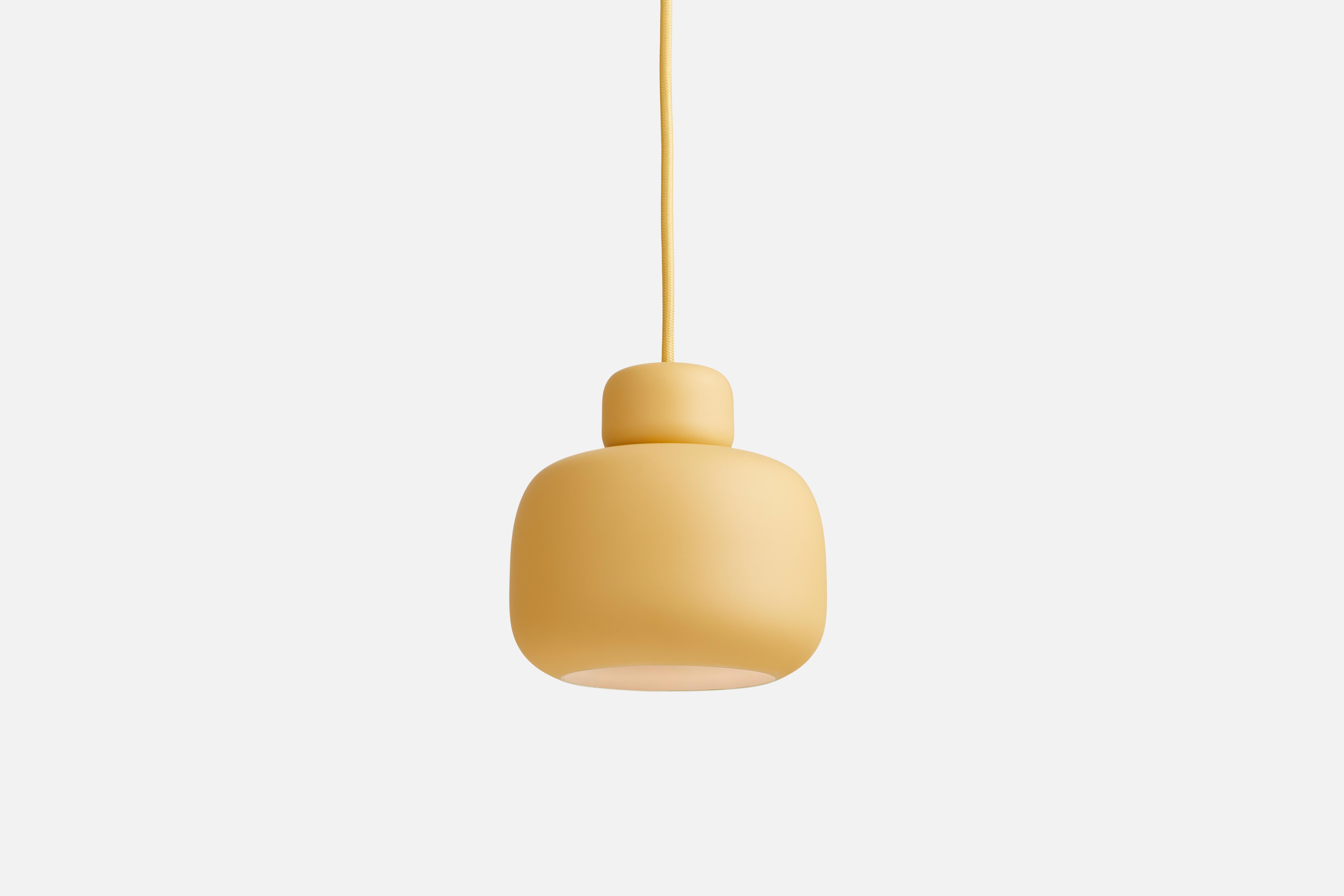 Yellow Stone pendant lamp by Philip Bro
Materials: Metal.
Dimensions: D 15.9 x H 16 cm
Available in yellow, white and black.

Philip Bro is an experienced Danish designer with a drive to prove that serious design can still be stylish, playful