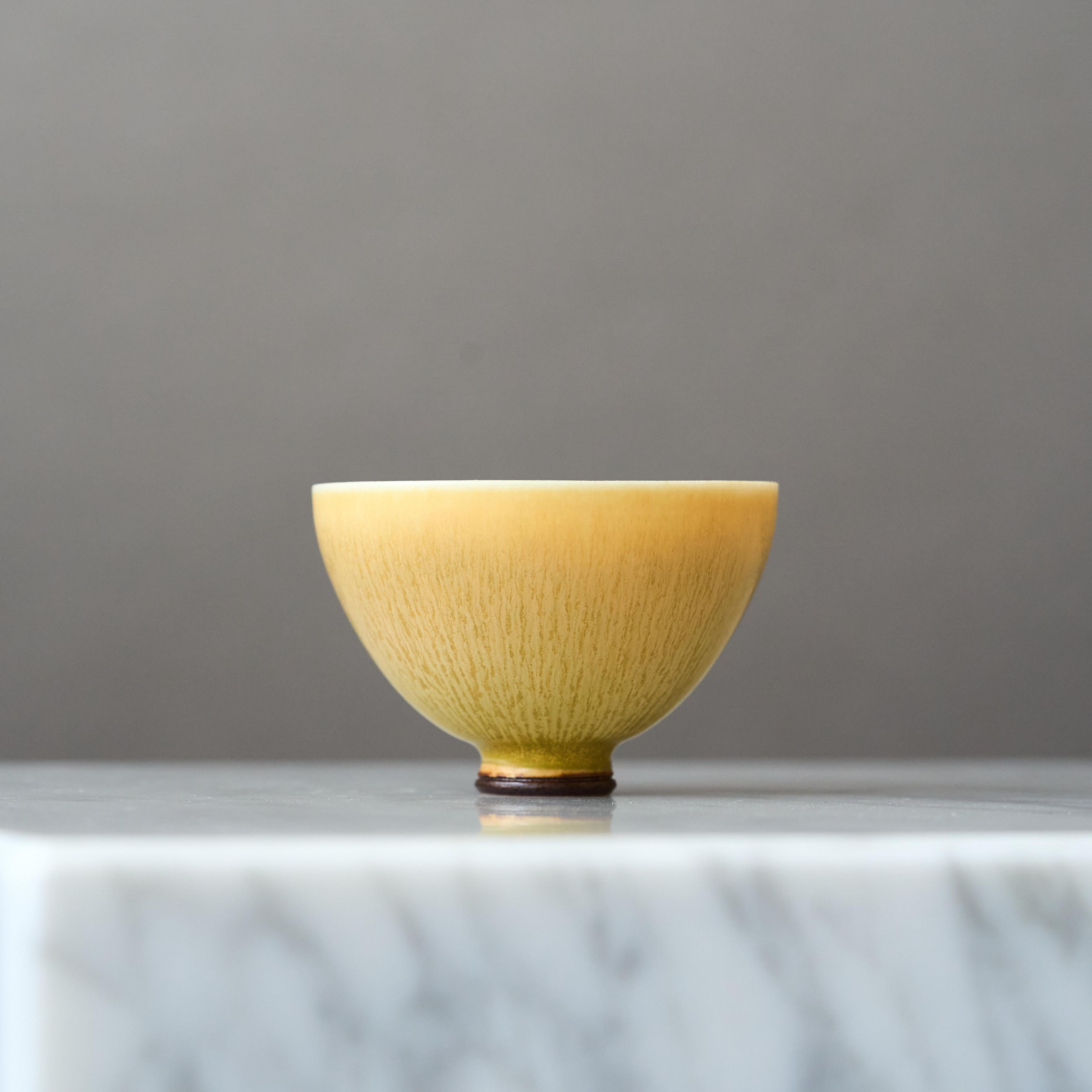 A beautiful miniature stoneware bowl with amazing yellow hare’s fur glaze.
Made by master thrower Berndt Friberg, in the artist's studio at Gustavsberg, Sweden, 1969.

Great condition. 
Incised signature 'Friberg' and Gustavsberg studio