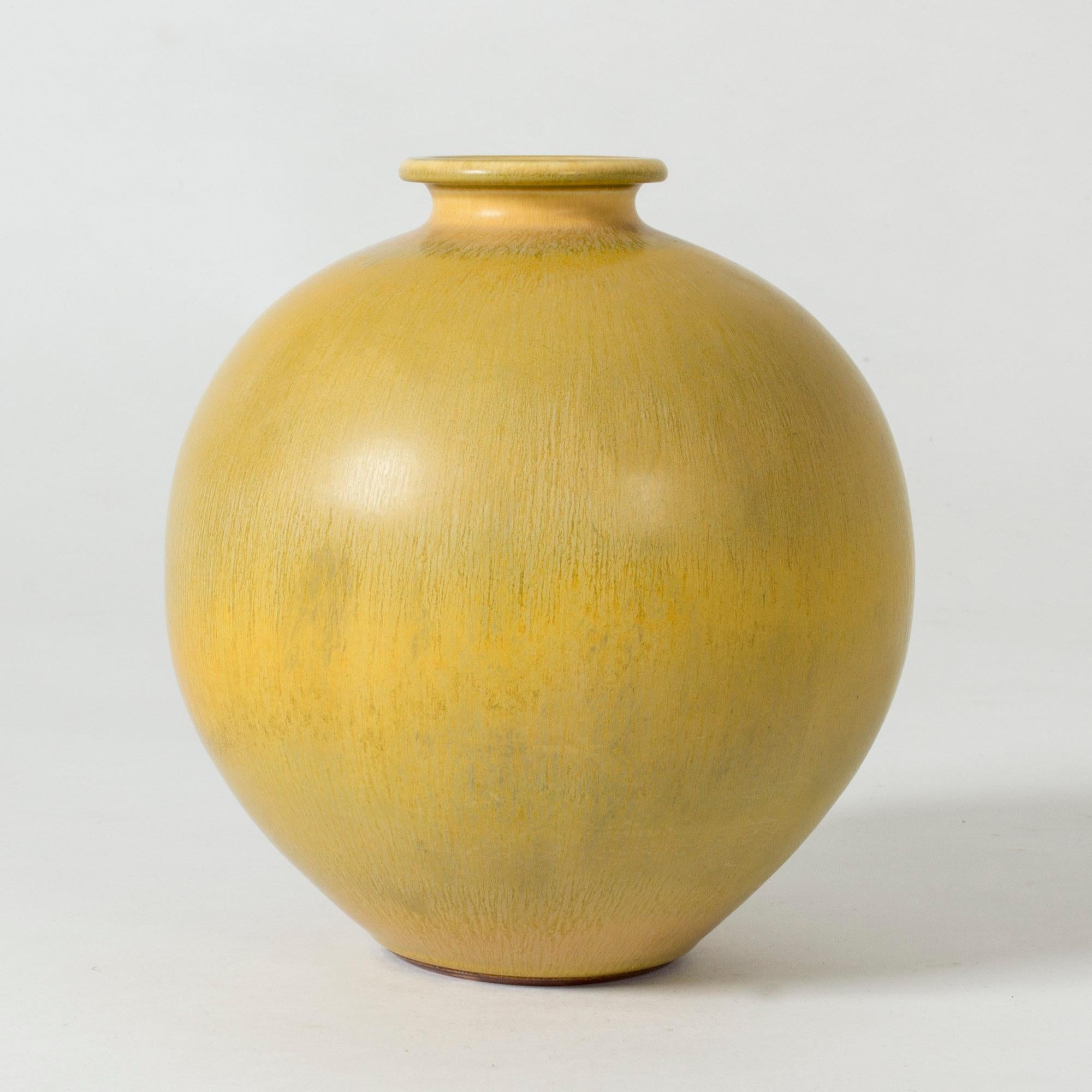 Beautiful round stoneware vase by Berndt Friberg, glazed with hare’s fur glaze. Striking yellow color.