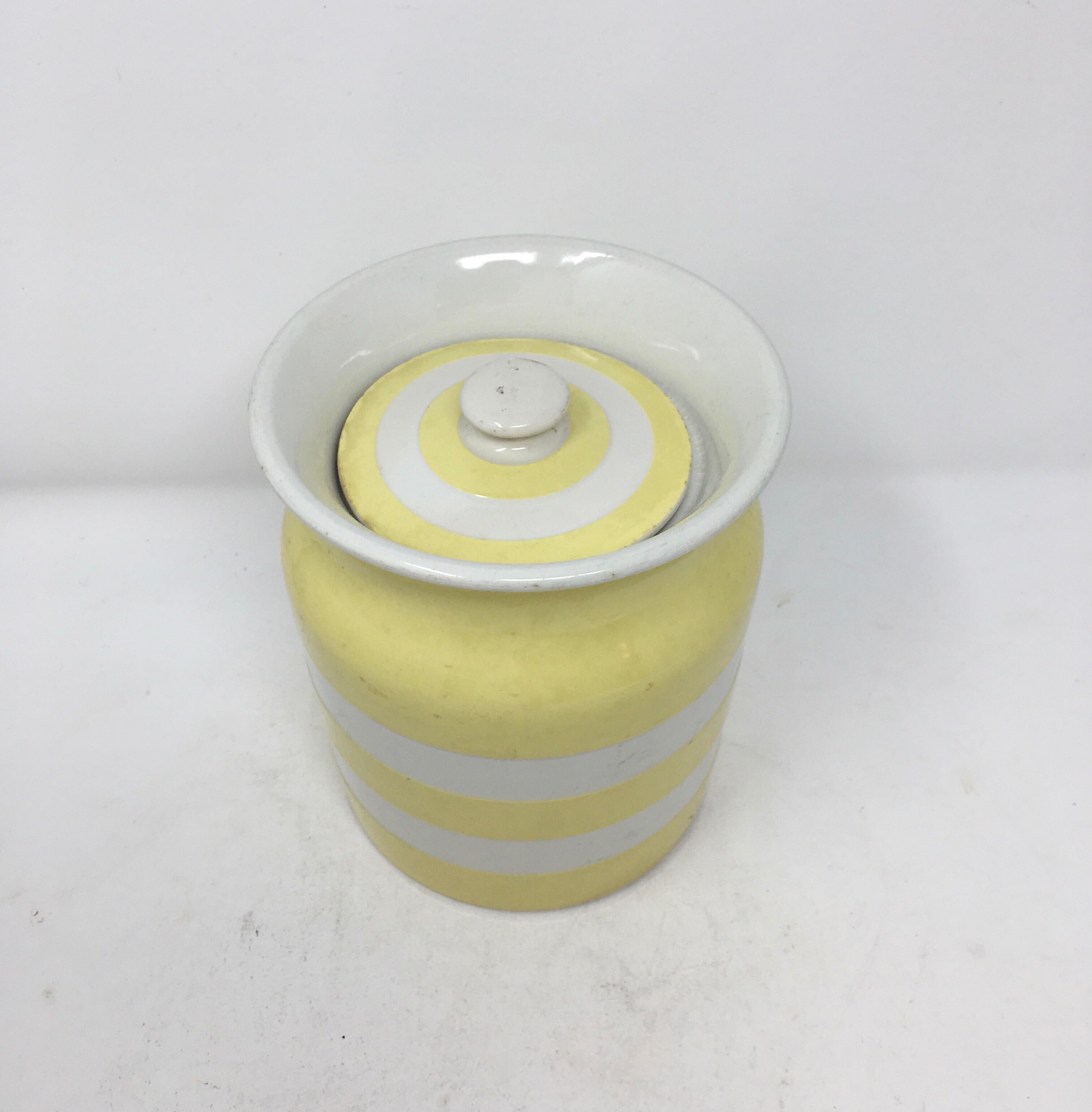 Found in England, this medium size Cornish Kitchen Ware ceramic storage cannister with lid is from makers TG Green, and is in the much rarer yellow color (most often you see these in blue). Made between the 1930s-1950s, this original vintage jar