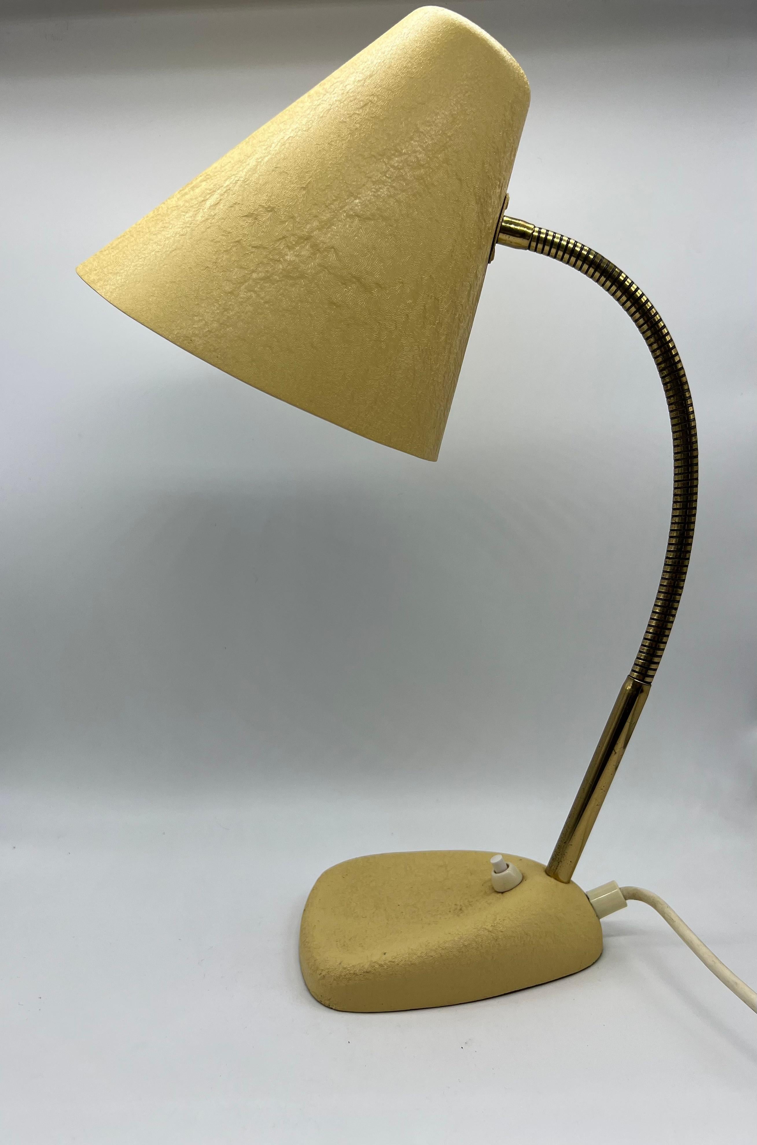 Yellow table lamp, with shrink varnish and movable shade, Modern, mid-20th century, good condition.

 