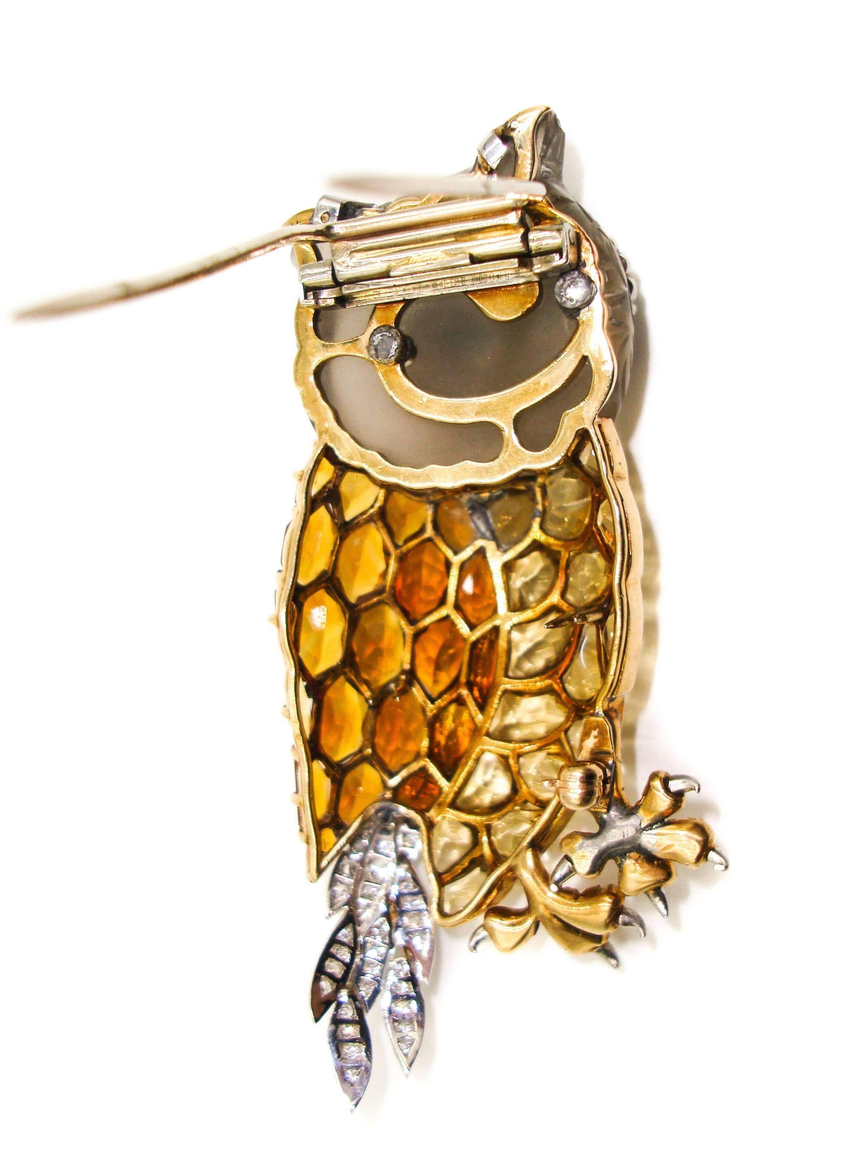 Nature is once again an inspiration to jewelry designers... 
This eye catching gold Owl brooch provides an unfaltering and unique look. 
Set in 14K yellow gold and comprised of yellow topaz, faceted citrine, carved smokey quartz, white round