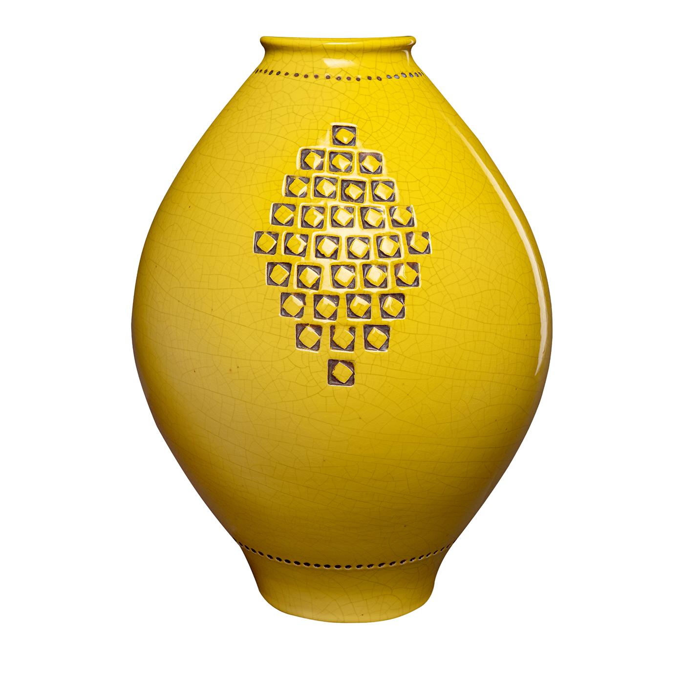 A medium-sized vase shaped on a potter’s wheel featuring a vivid yellow glossy craquelé glaze. The surface is decorated with a stamped incised geometric pattern in relief, creating a subtle contrast with the background. This vase is part of a