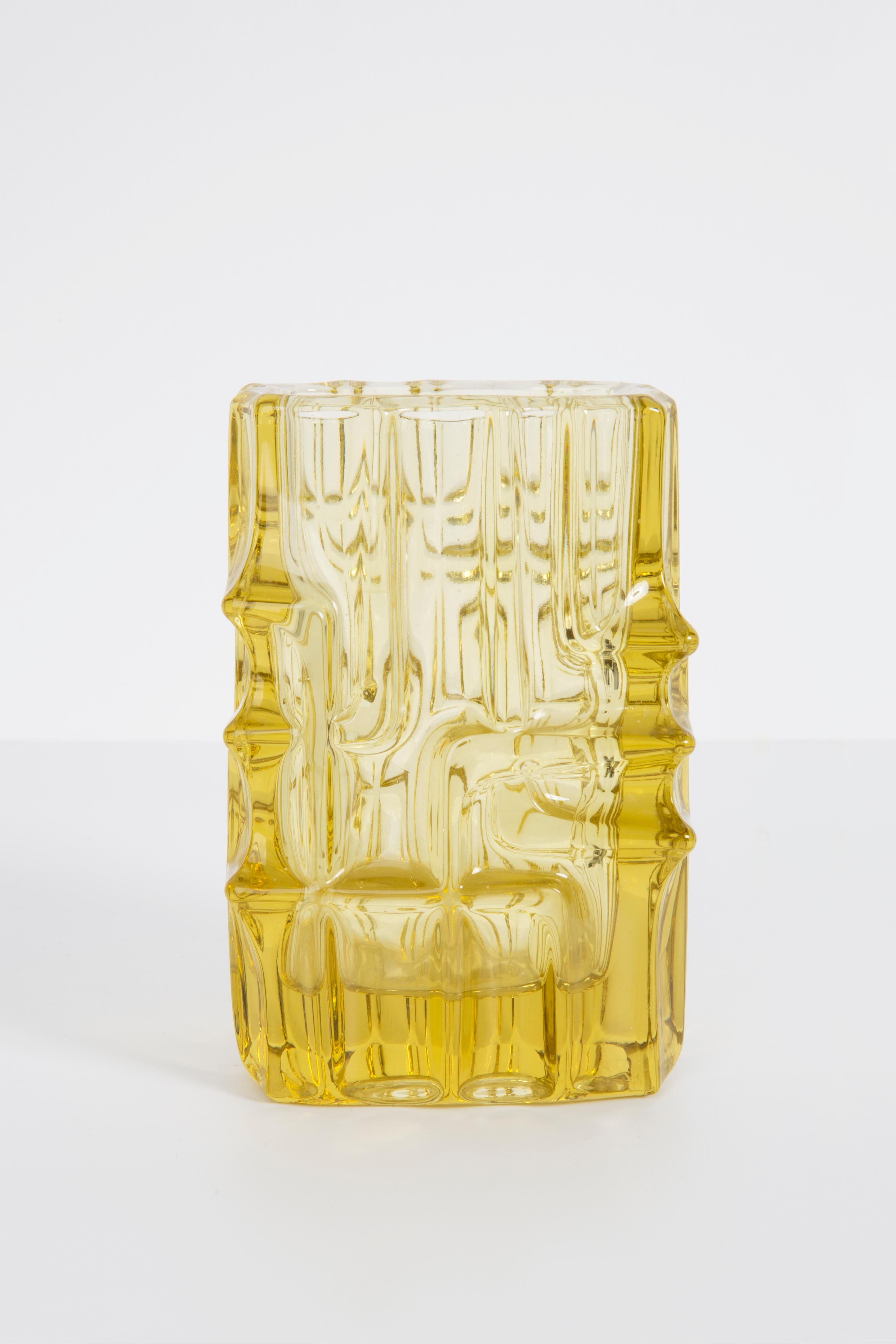 Light yellow vase by Vladislav Urban, Czechoslovakian glass designer. Produced in 1960s.
Pressed glass in perfect condition. The vase looks like it has just been taken out of the box.
No jags, defects etc. The outer relief surface, the inner