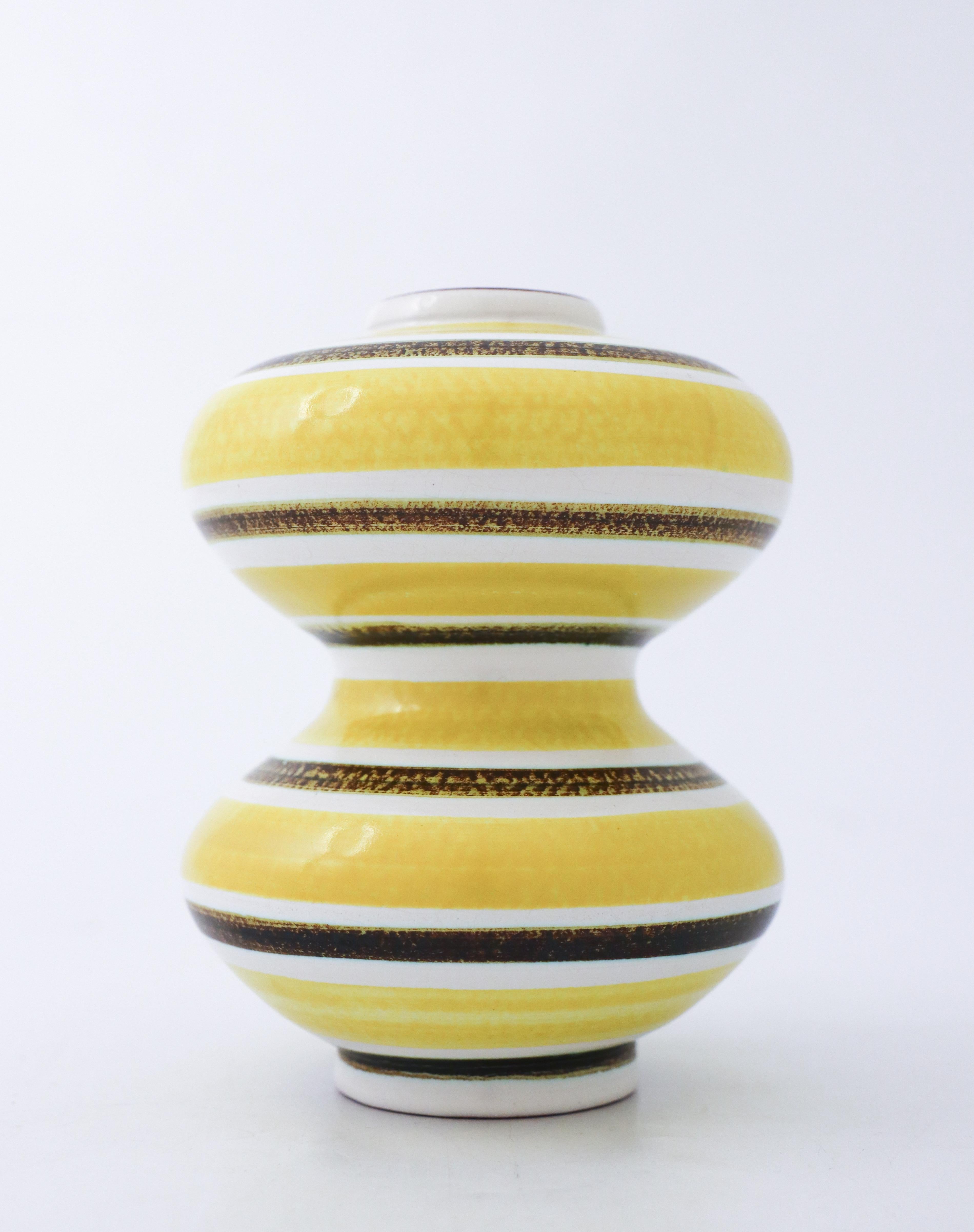 A vase in faience designed by Stig Lindberg at Gustavsbergs Studio in Stockholm, it is 13.5 cm (5.4