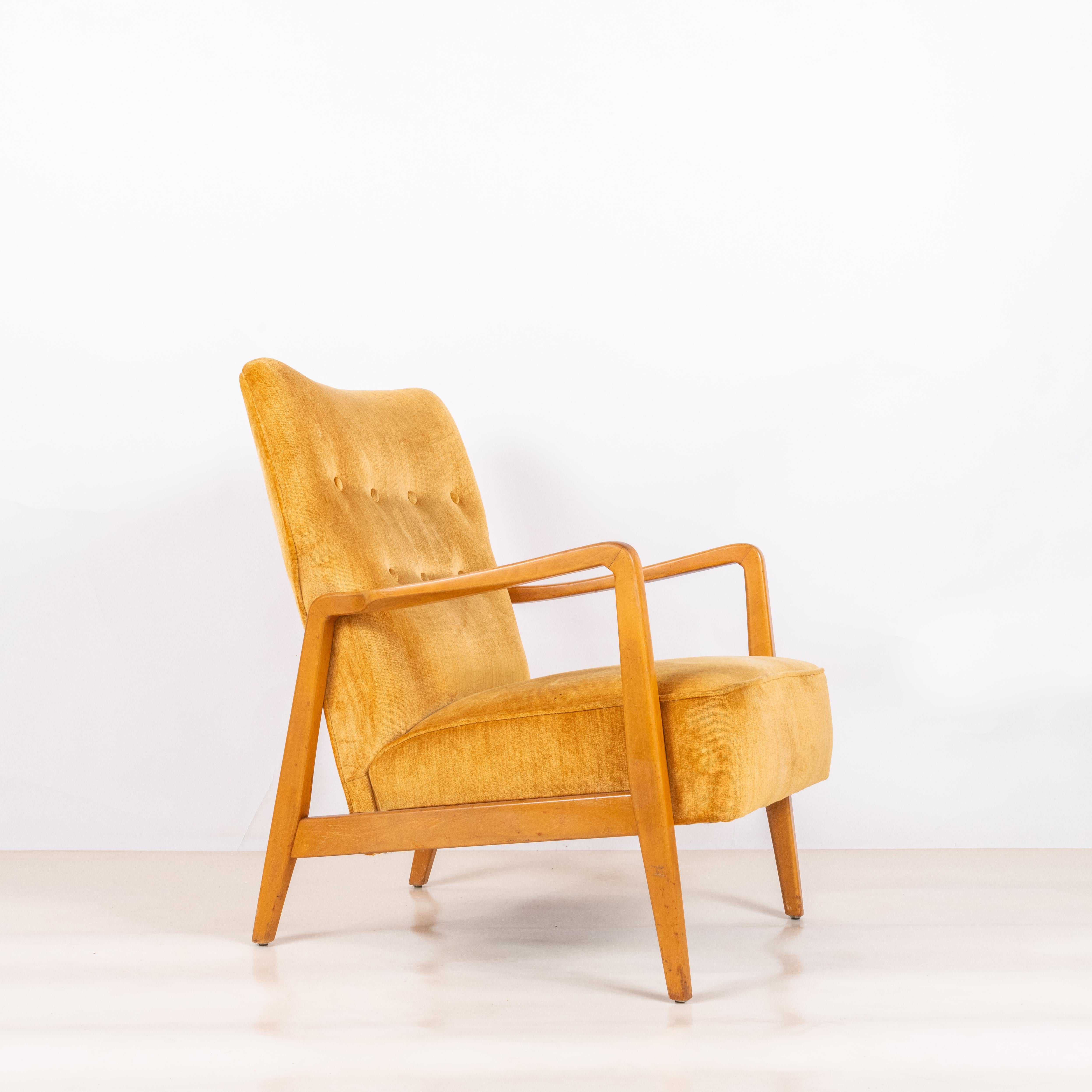 Comfortable yellow velvet American Midcentury armchair in the style of Jens Risom.

