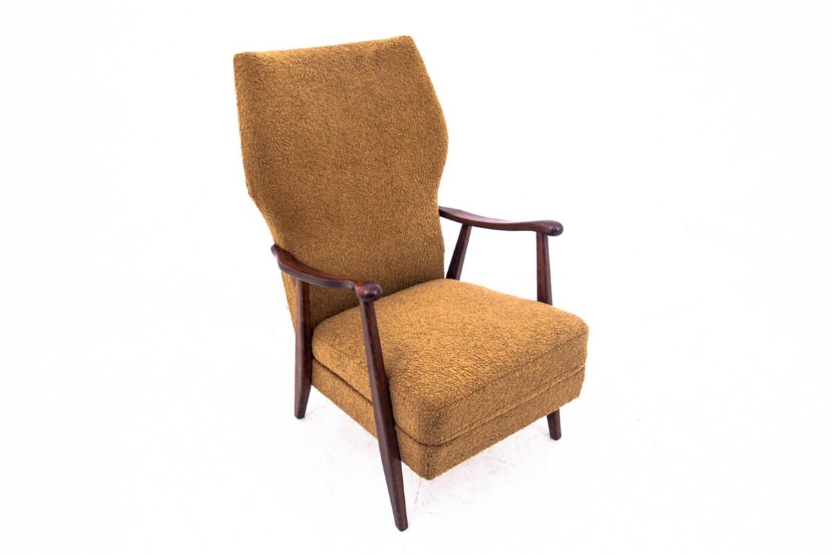 Yellow armchair in the midcentury modern style. Made in Denmark in the 1960s. It will fit perfectly into contemporary interiors.

In our workshop it underwent a thorough renovation and was covered with a new yellow bouclé fabric. The wood was