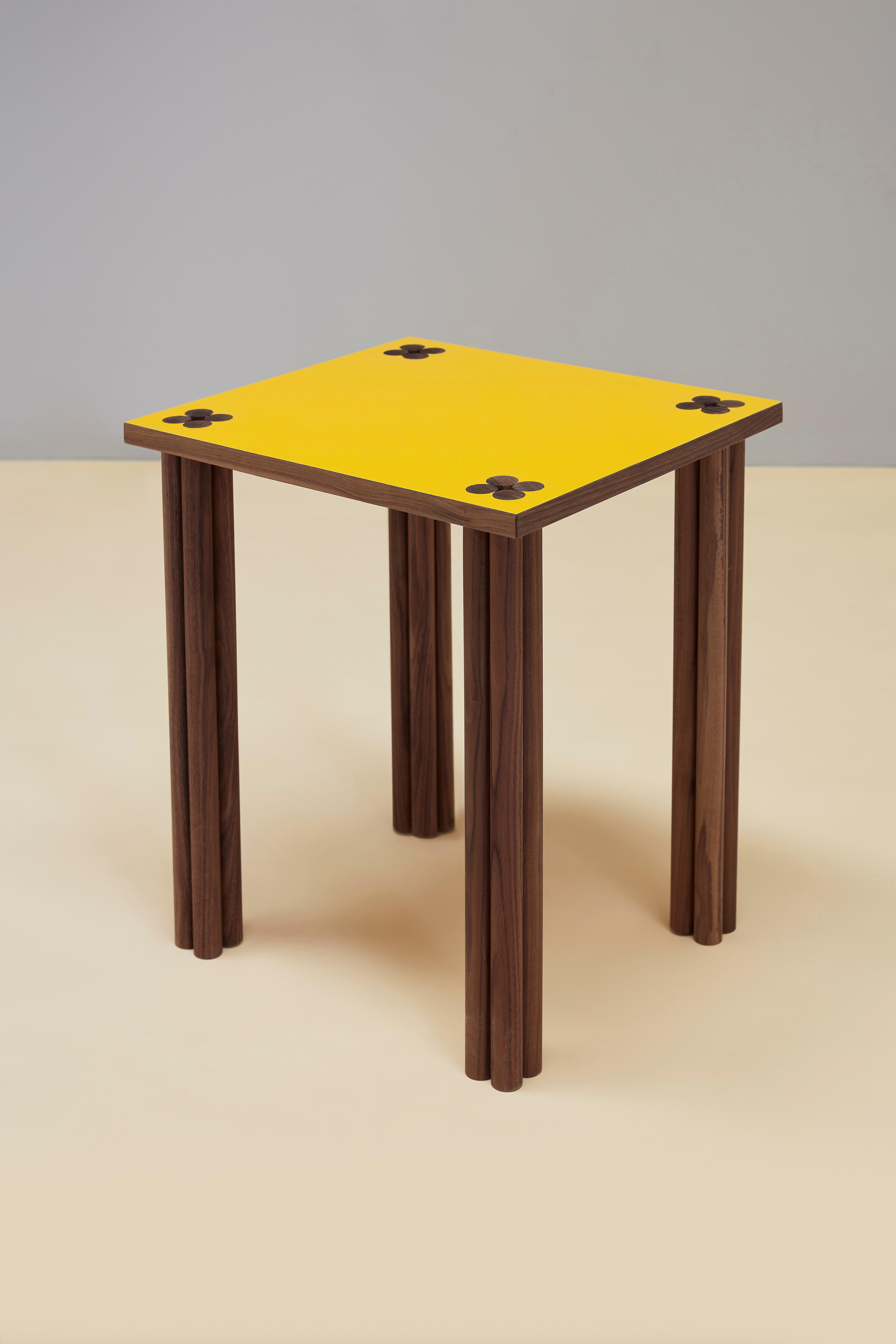 Yellow & walnut Hana side table.
Dimensions: D 38 x W 43 x H 50 cm
Materials: solid walnut wood, walnut veneer, Formica
Oak or other wood possible. 

Hana is Japanese and means flower - it is a collection of side tables and a sideboard. The name
