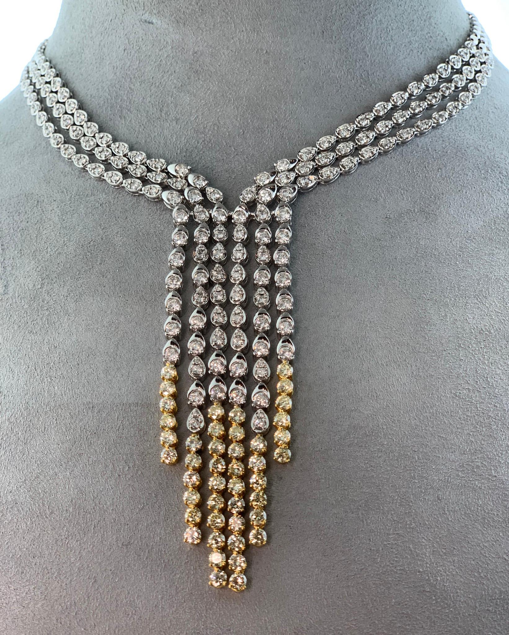 Yellow White Diamond 18k White Gold Necklace. Beautiful drop chandler necklace is 16 inches around neck and drops 4 inches. Total weight 67.33 Grams. Total carat weight approximately 15 carats 