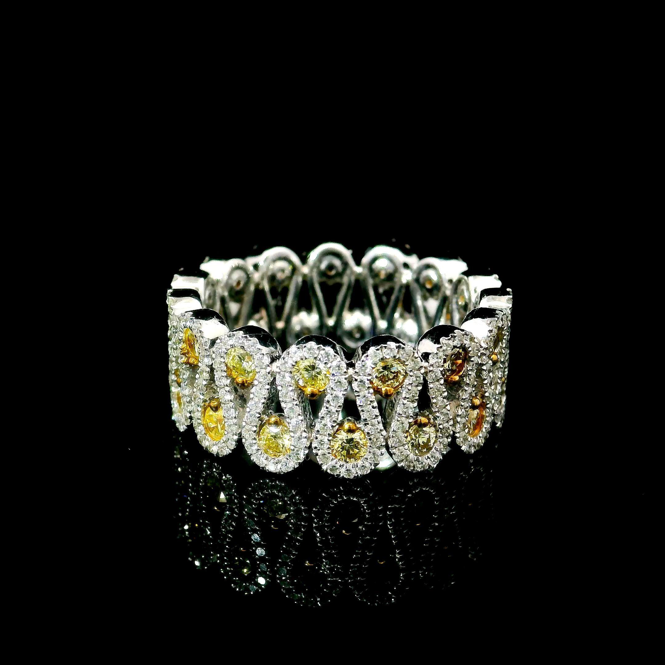 18kt white gold ring with diamonds
  
  Gold colour & Carat: White gold 18kt
  Weight: 2.63 grams
  
  Surrounding Stones: Diamonds
 1) White Diamonds
  Carat weight: 0.88 ct (300 pcs)
  Color: F
  Clarity: VS1/VS2
  Cut: Round

2) Yellow Diamonds
 